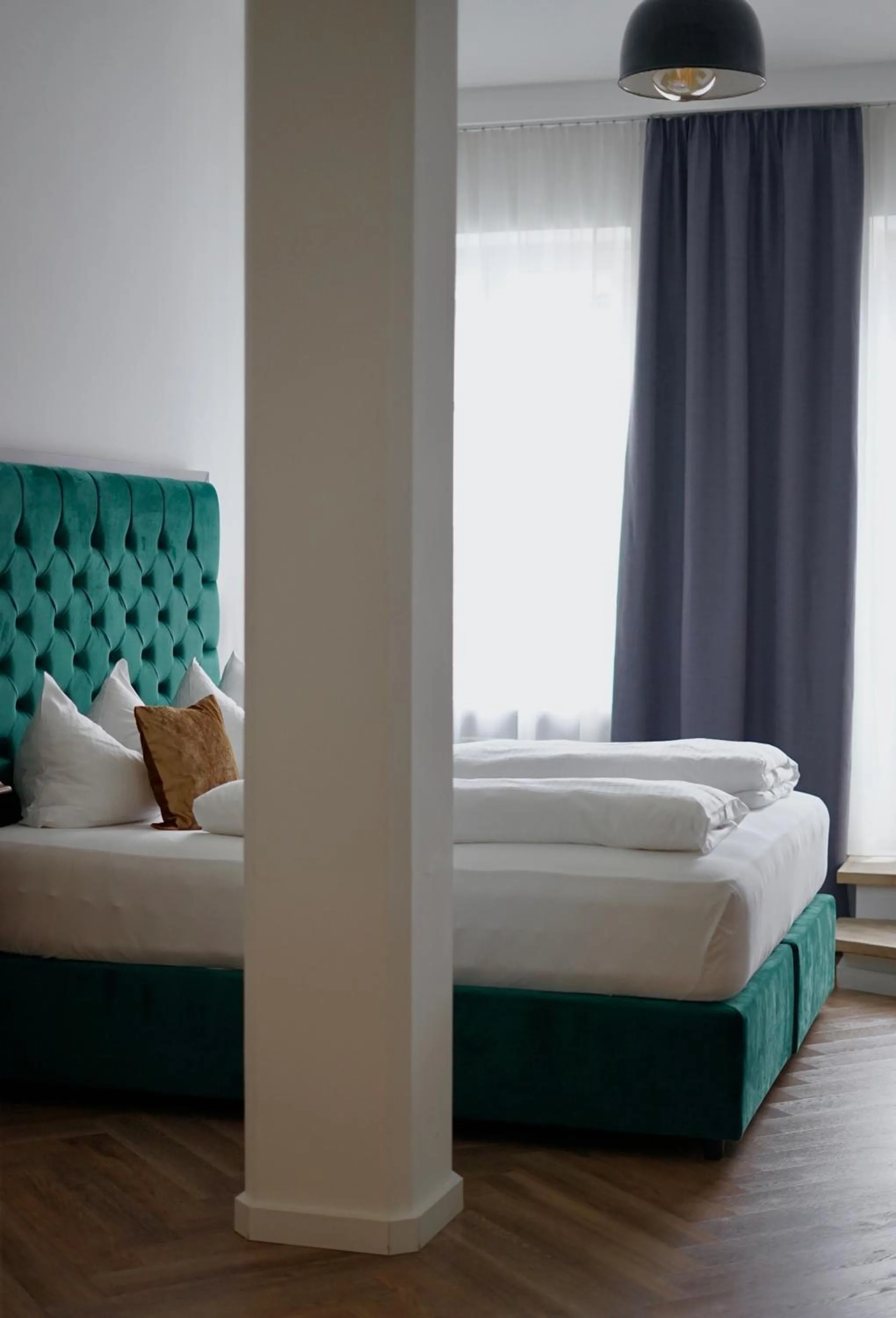 Bed in Hotel Mühldorf
