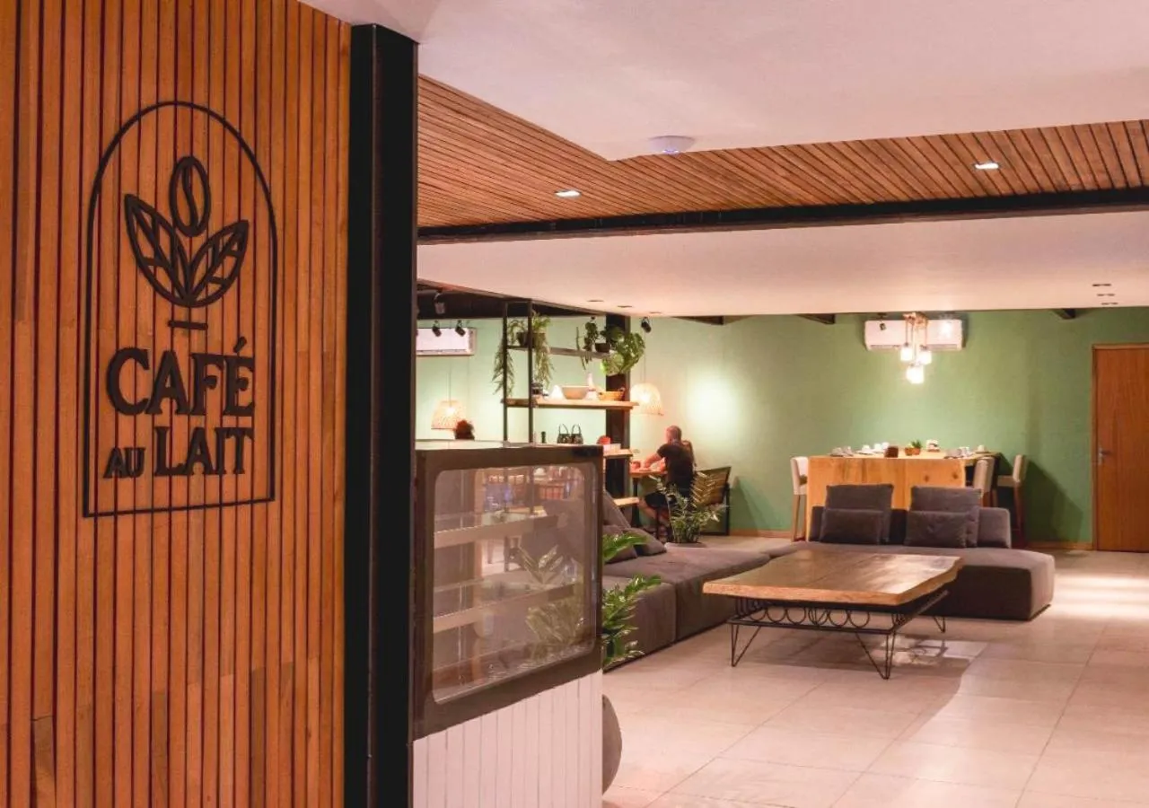 Communal lounge/ TV room, Bed in Grão Pará Petrópolis