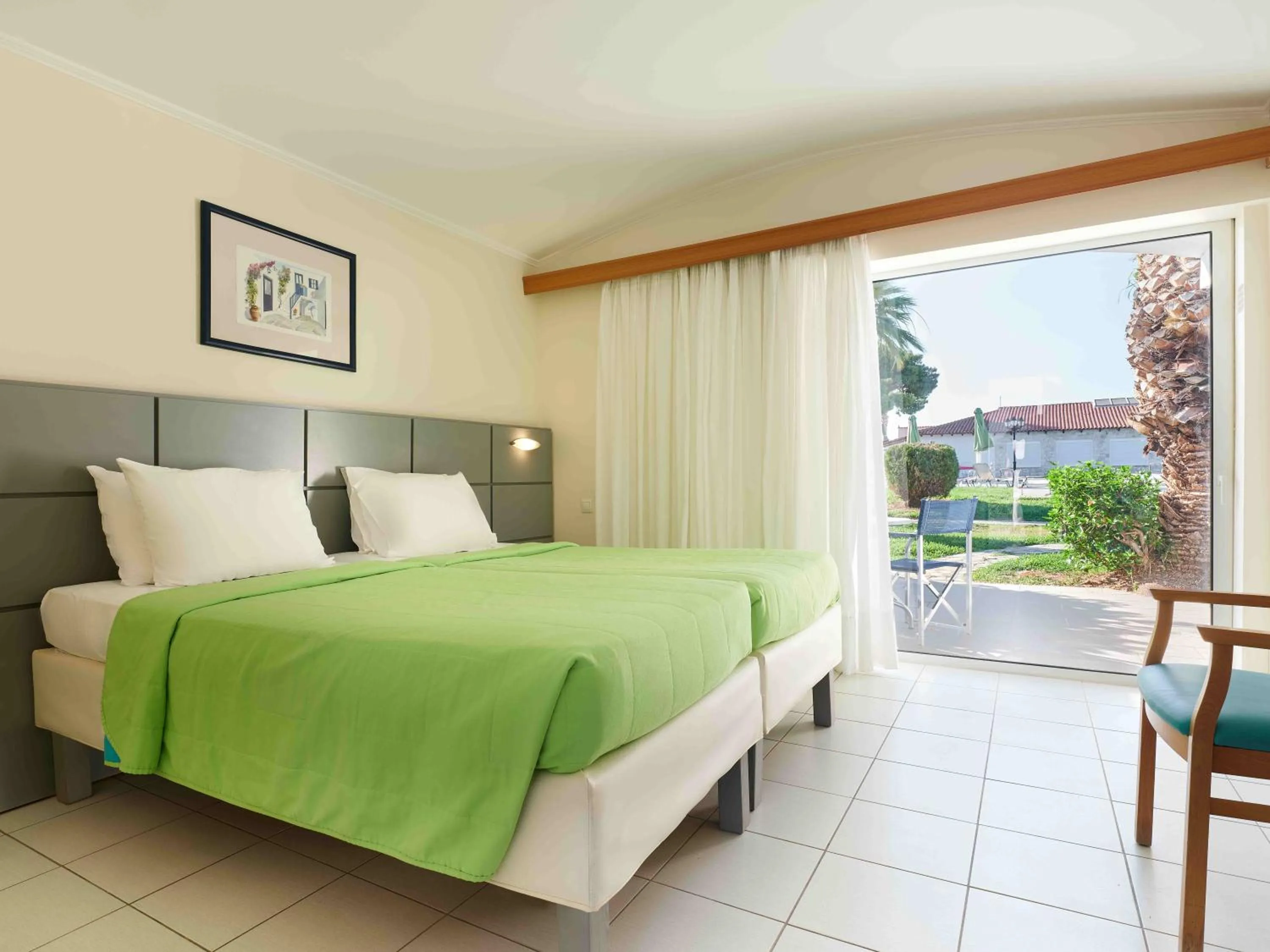 Bed in Kinetta Beach Resort and Spa