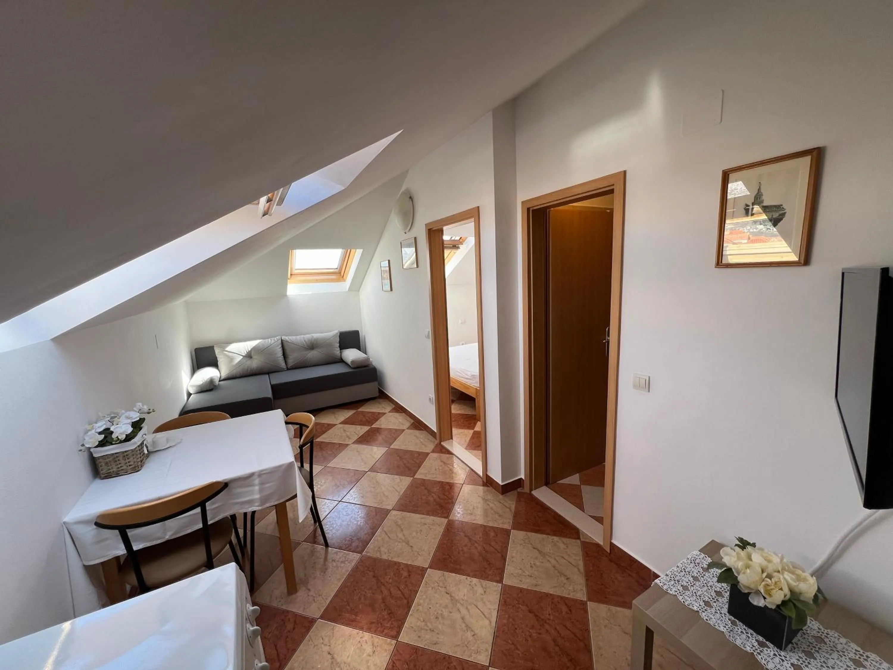 Communal lounge/ TV room, Bed in Apartments and Rooms Katija & Egon