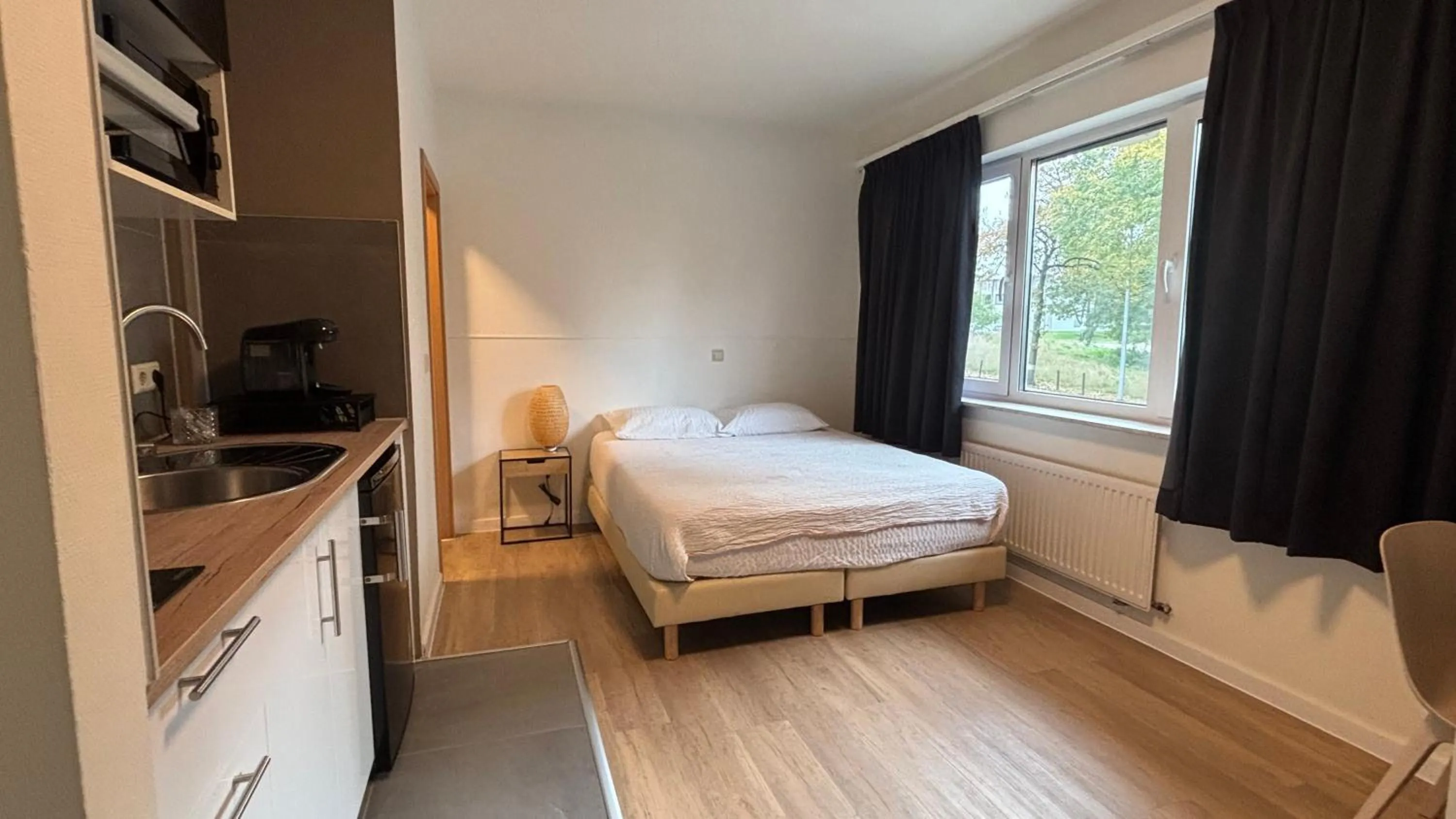 Bed in Aramis Studio Hotel