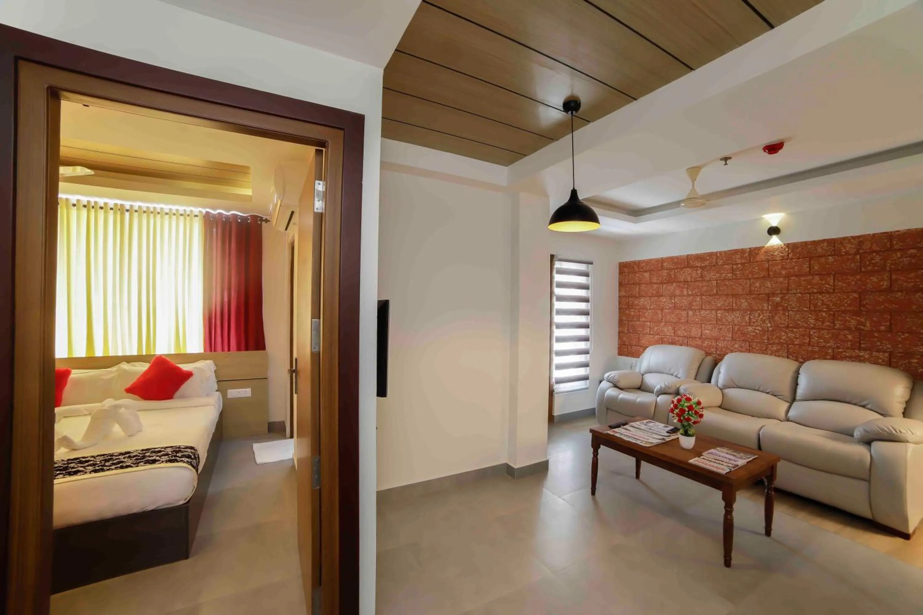 Photo of the whole room, Bed in Bhavanam Regency Guruvayoor