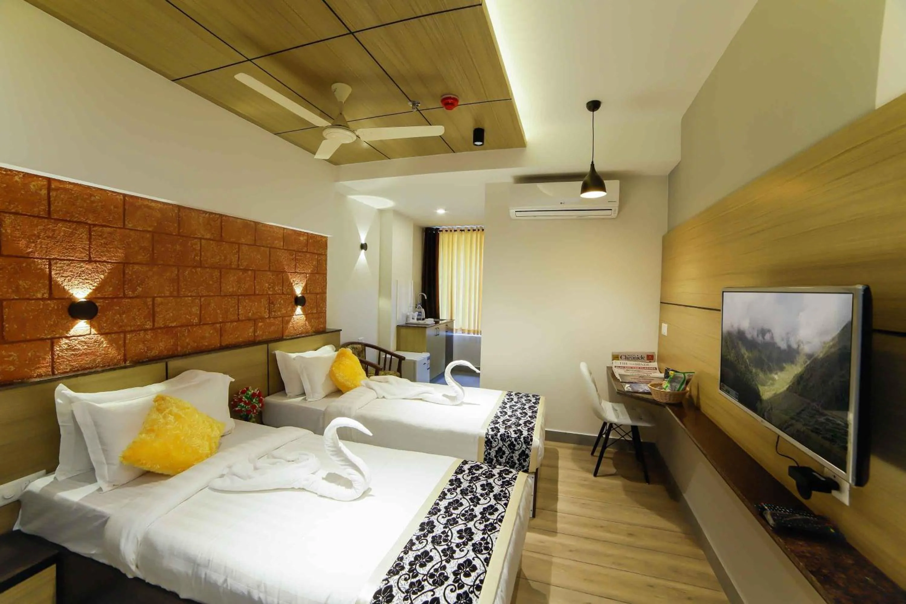 Photo of the whole room, Bed in Bhavanam Regency Guruvayoor