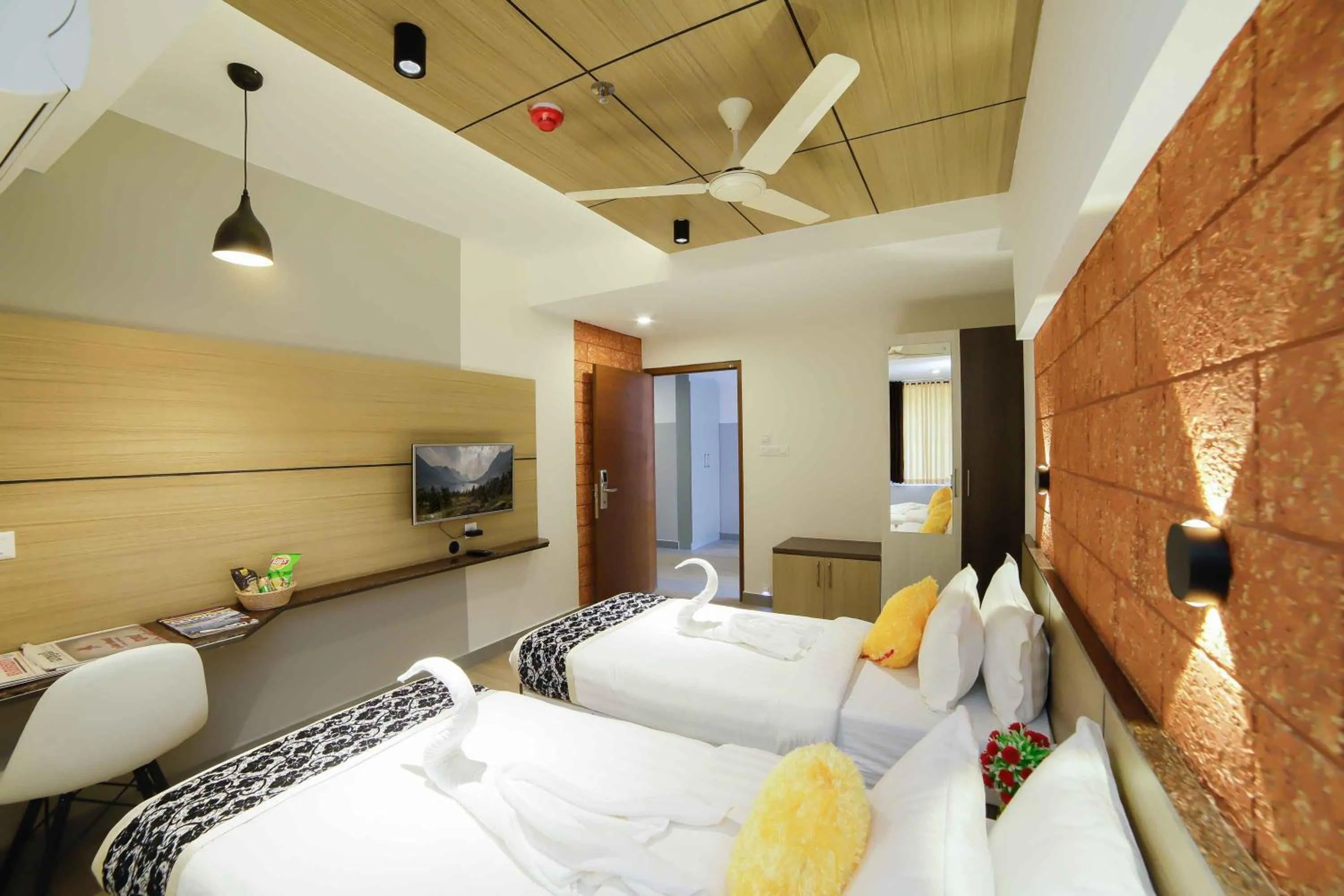 Photo of the whole room, Bed in Bhavanam Regency Guruvayoor