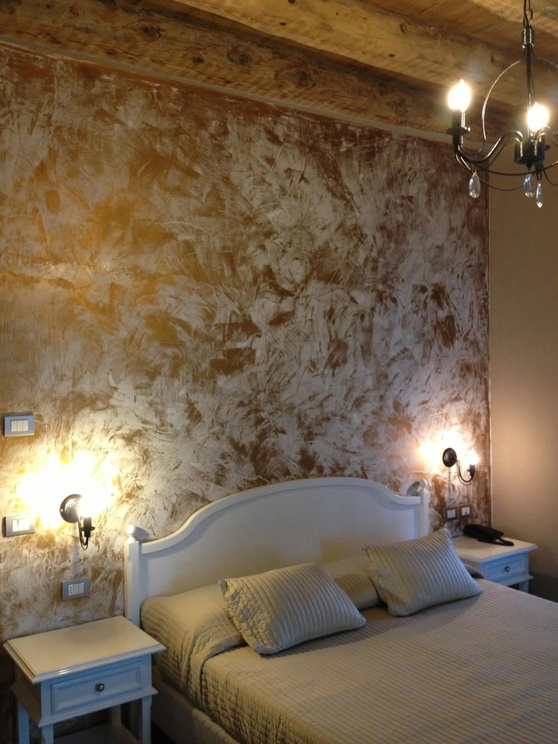 Decorative detail, Bed in Hotel Baia dei Pini