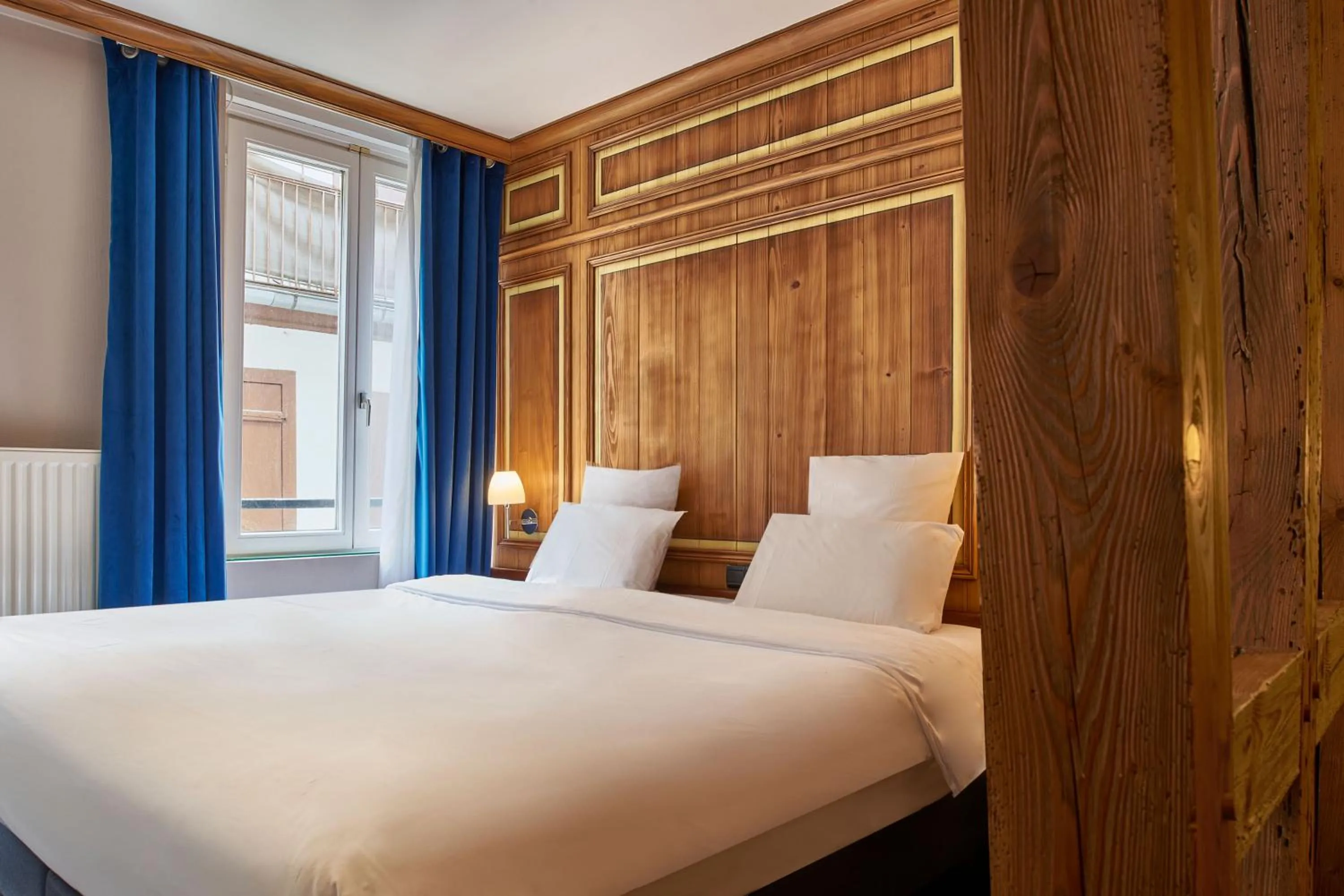 Bed in Hôtel de l'Europe by HappyCulture