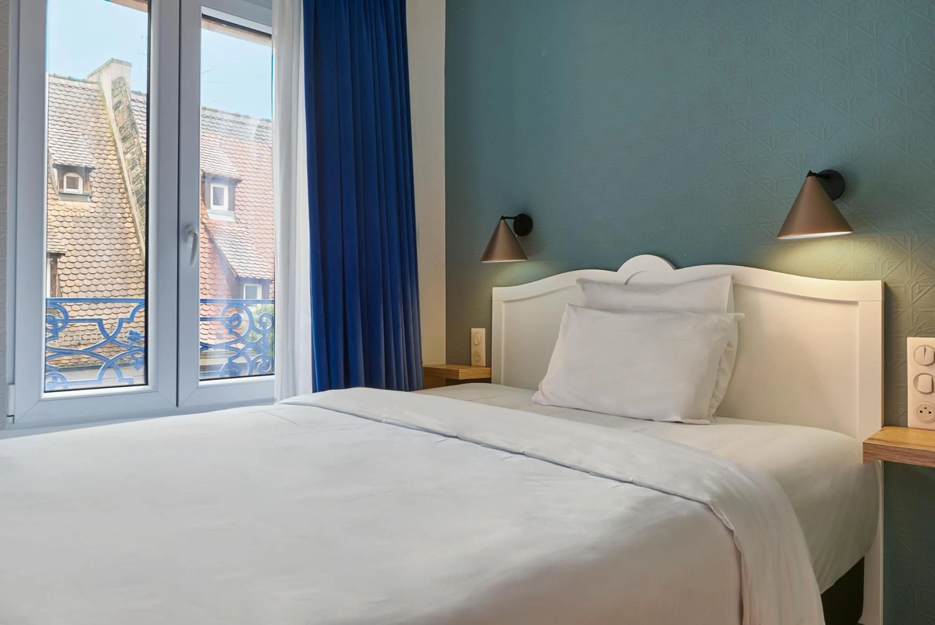 Bed in Hôtel de l'Europe by HappyCulture