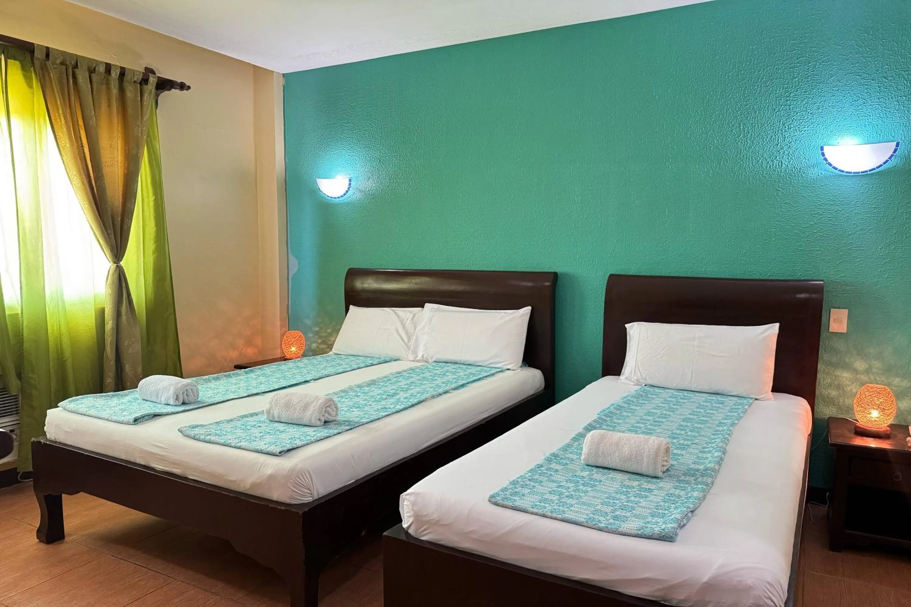 Bed in OveMar Resort Hotel near Vigan