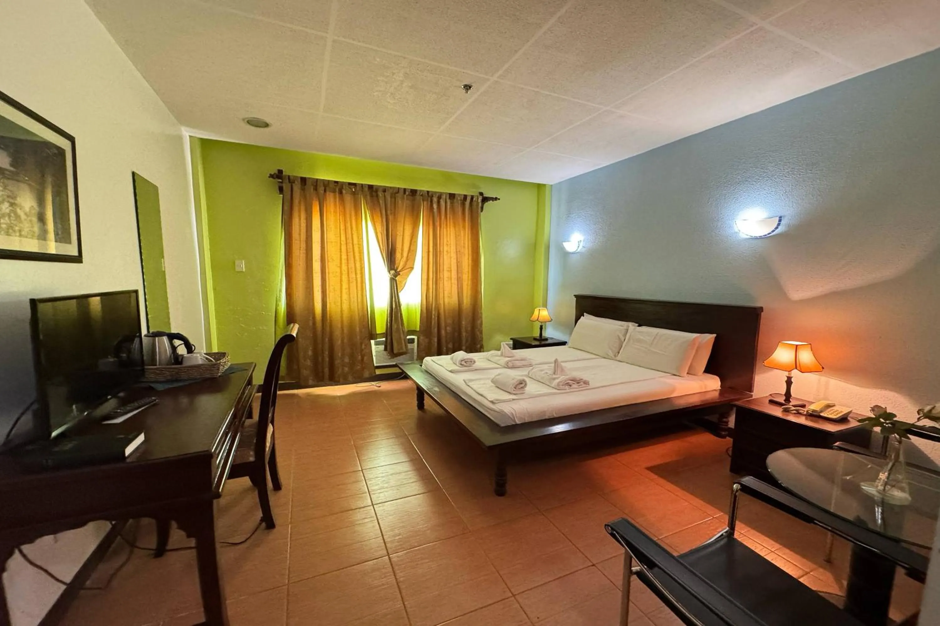 Bed in OveMar Resort Hotel near Vigan