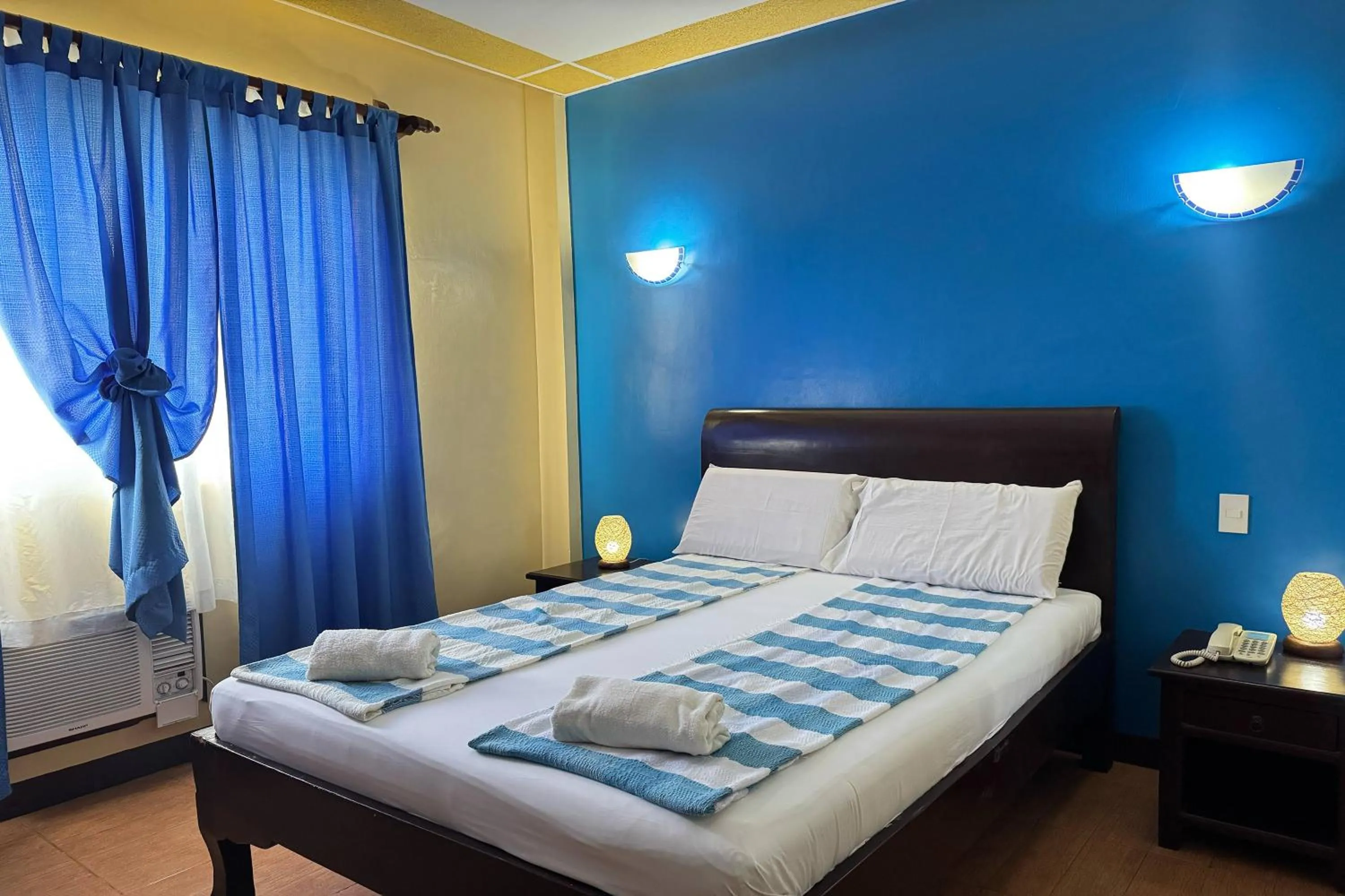 Bed in OveMar Resort Hotel near Vigan