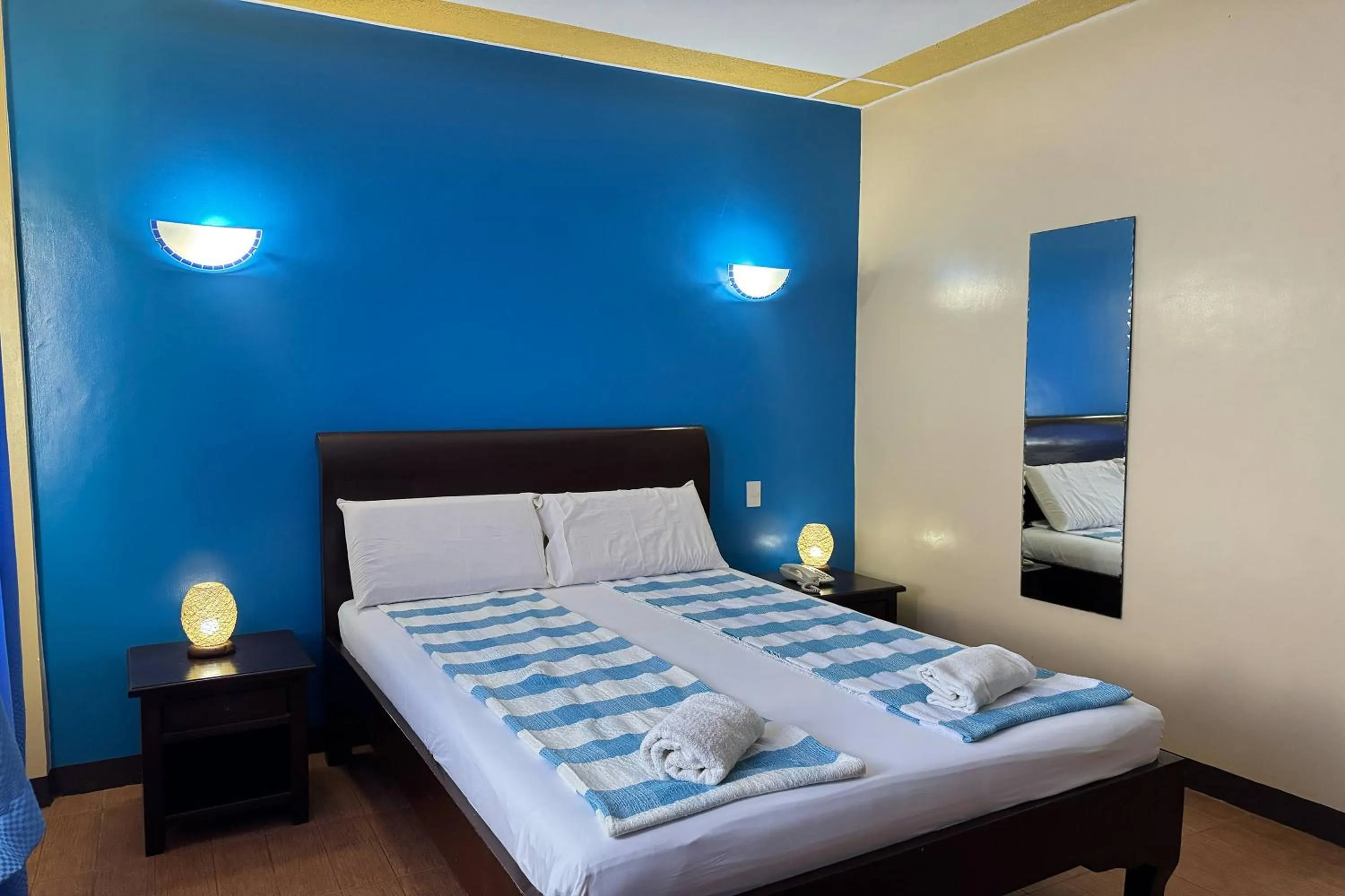 Bed in OveMar Resort Hotel near Vigan