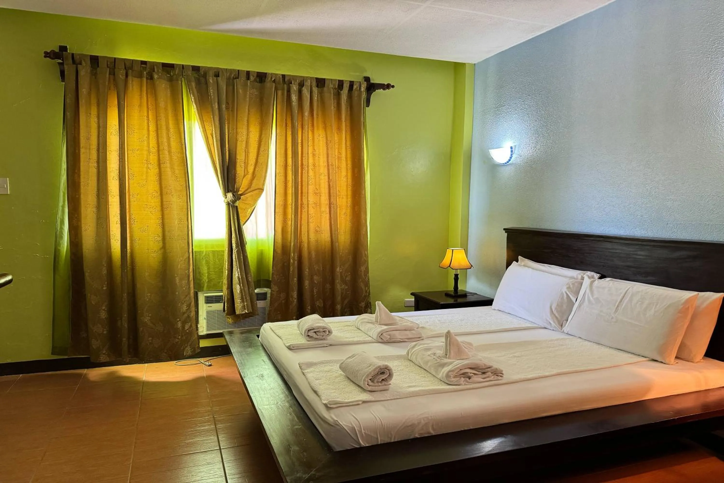 Bed in OveMar Resort Hotel near Vigan