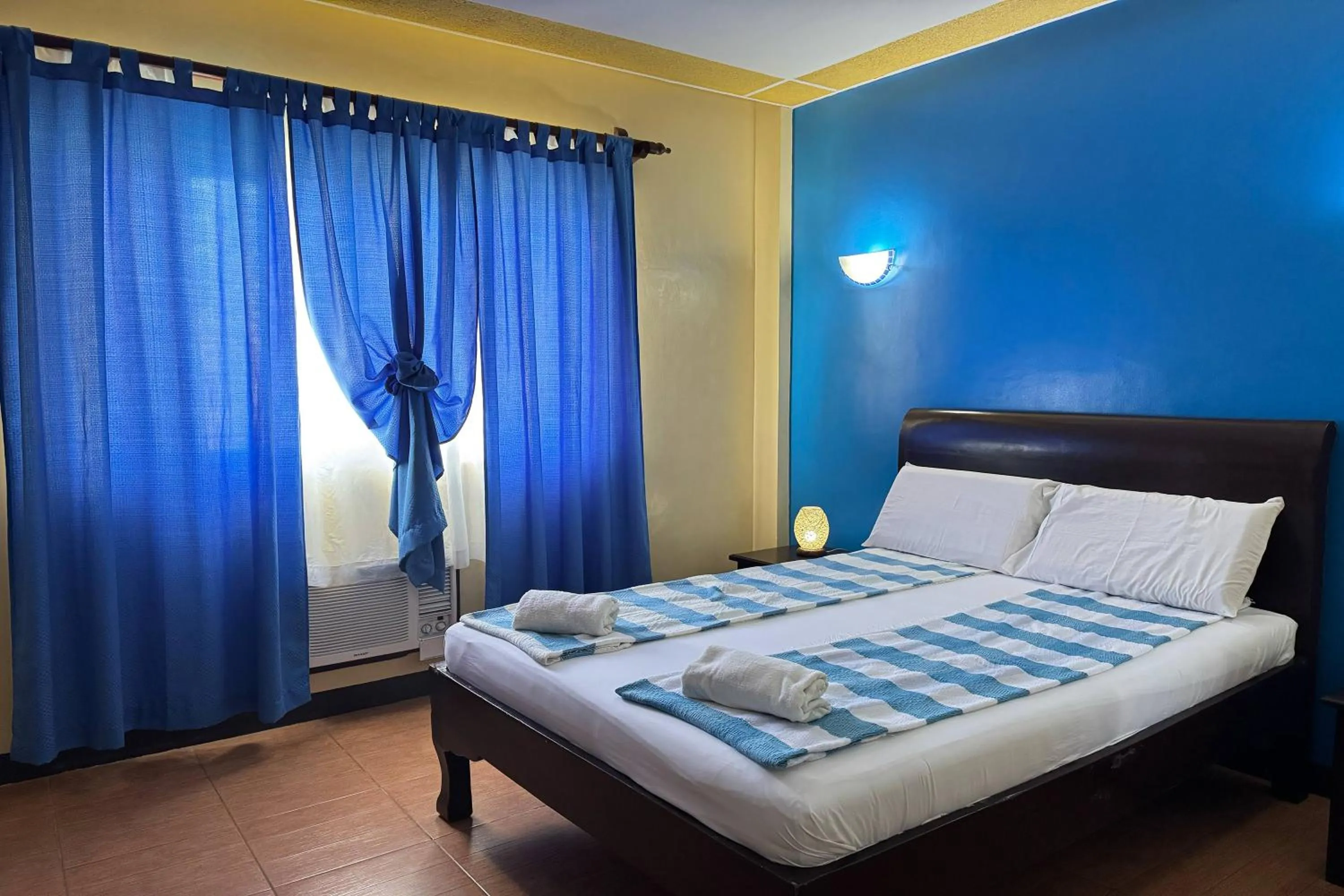 Bed in OveMar Resort Hotel near Vigan