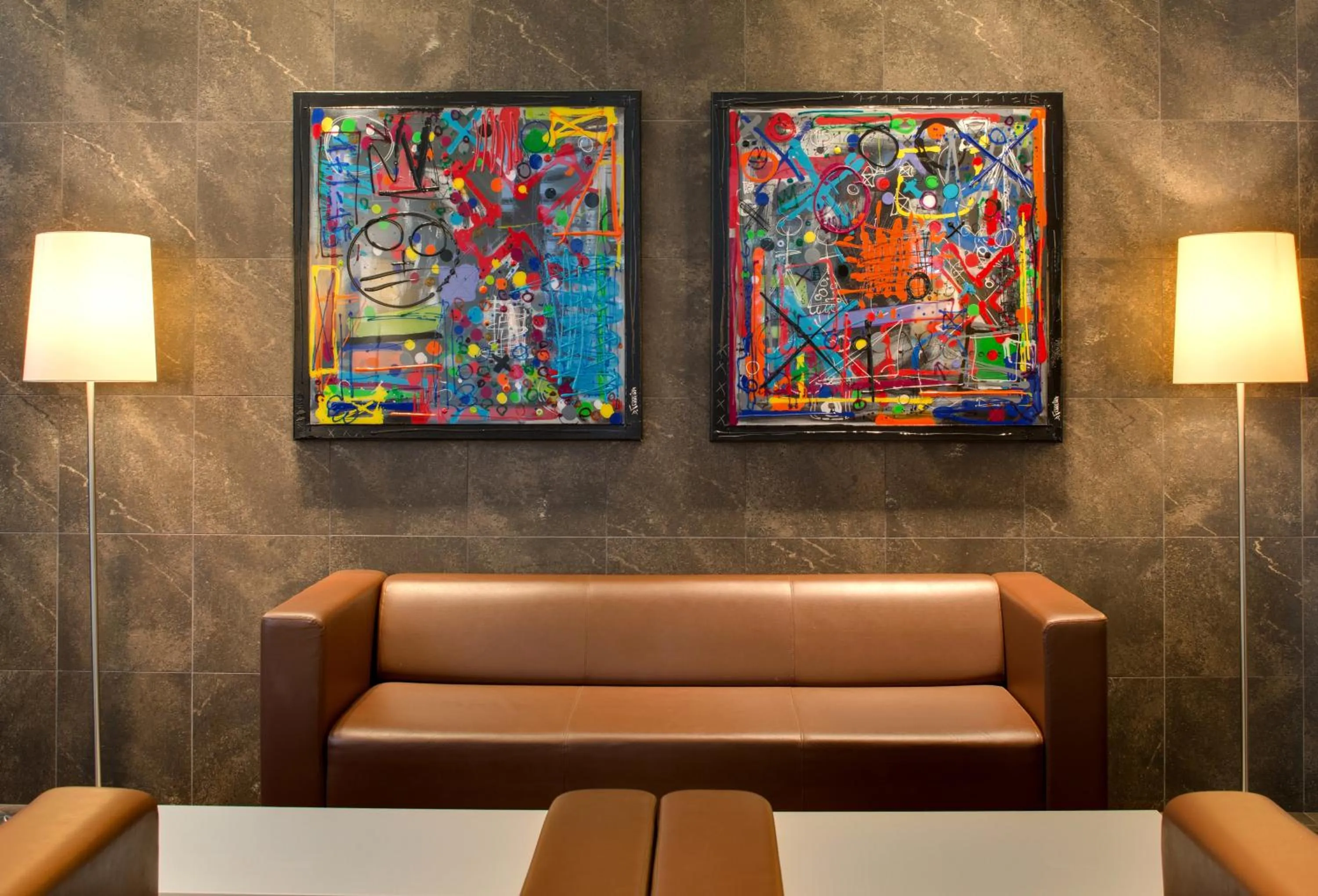 Communal lounge/ TV room in Hôtel Le Méditerranée