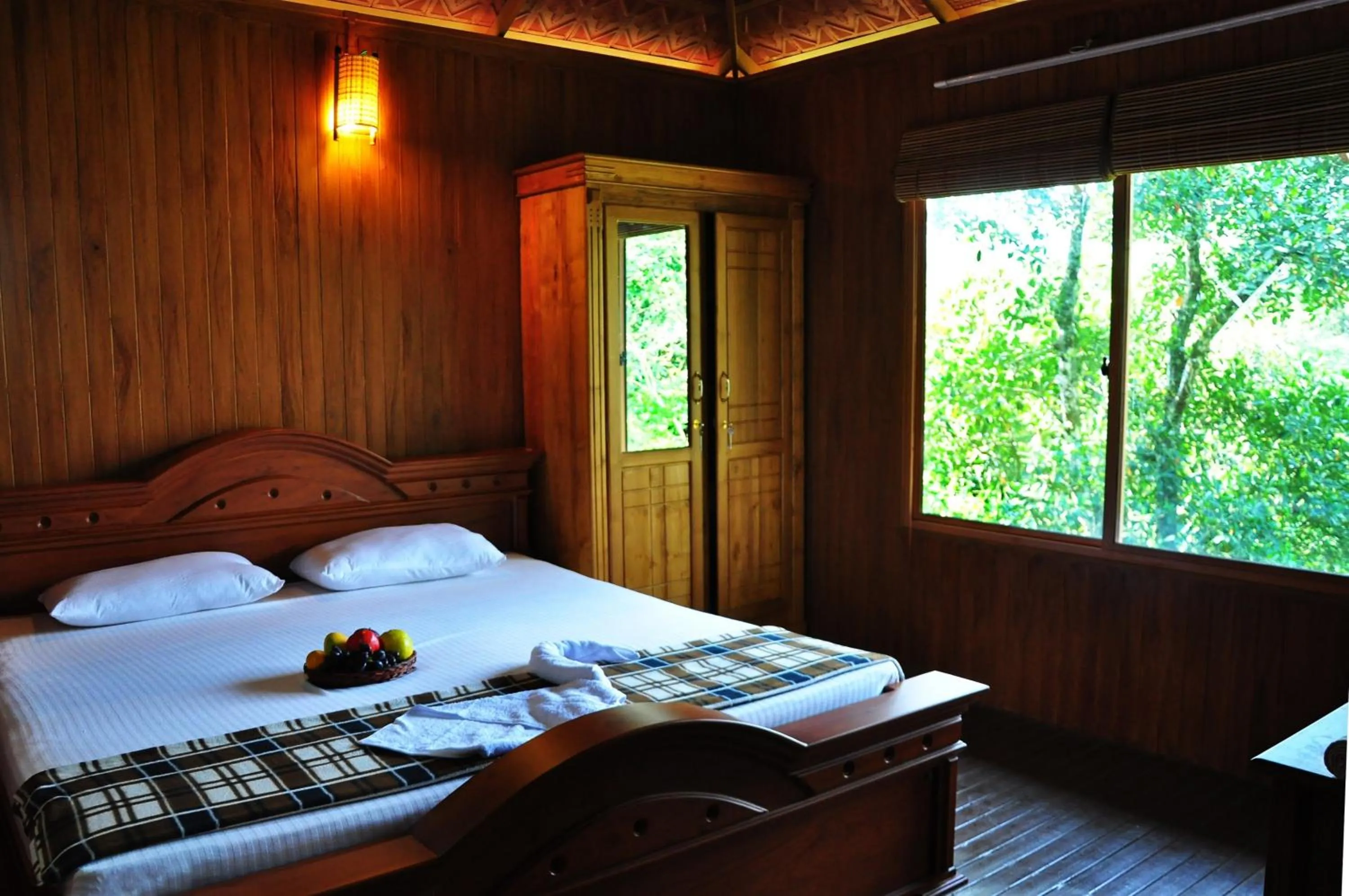 Bed in Planet Green Plantation Resorts, Wayanad, Kerala