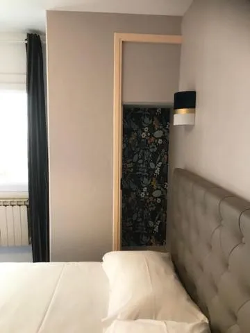 Bed in Hôtel Aunis-Saintonge