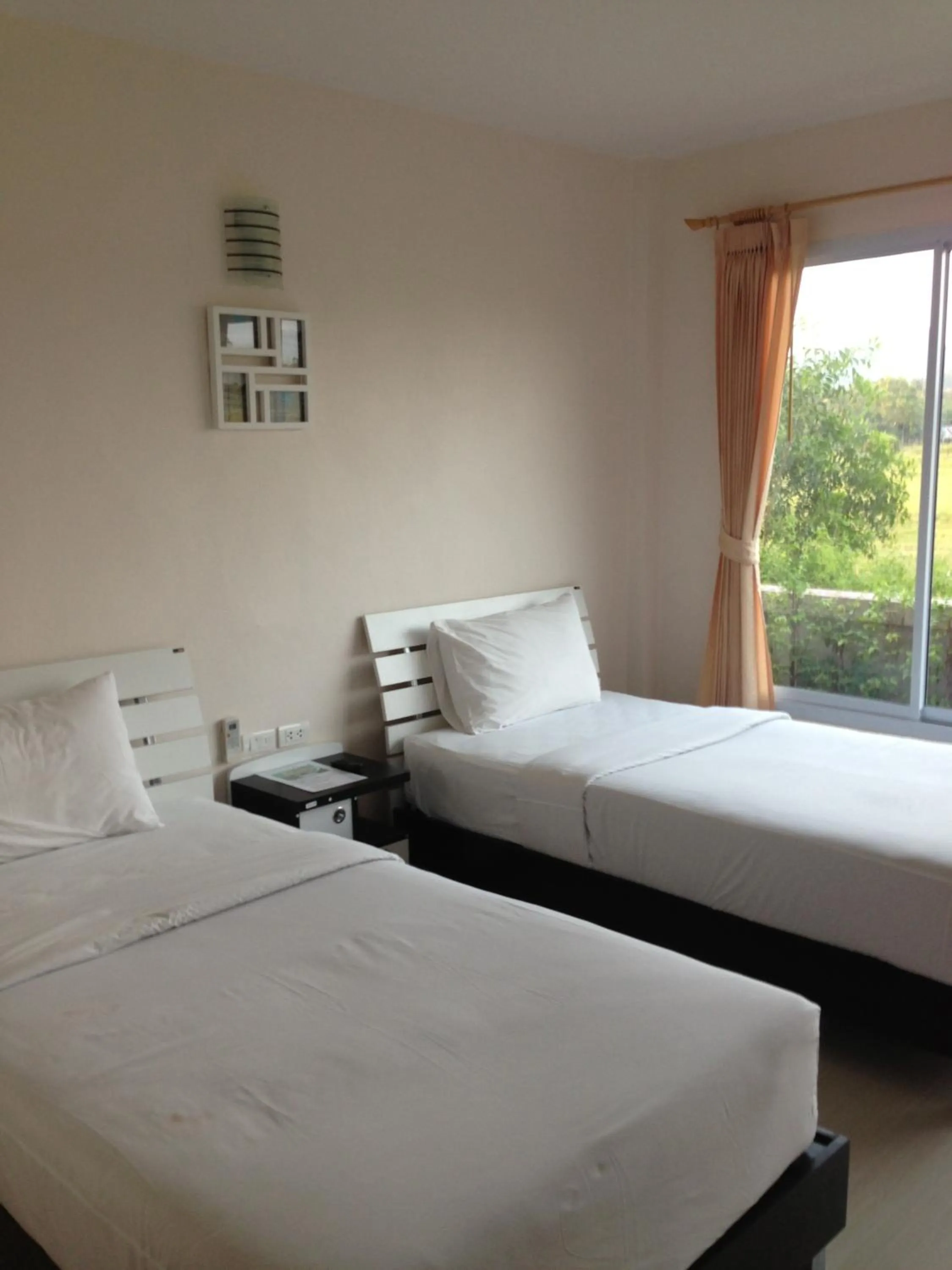 Bed in Siriburi Resort