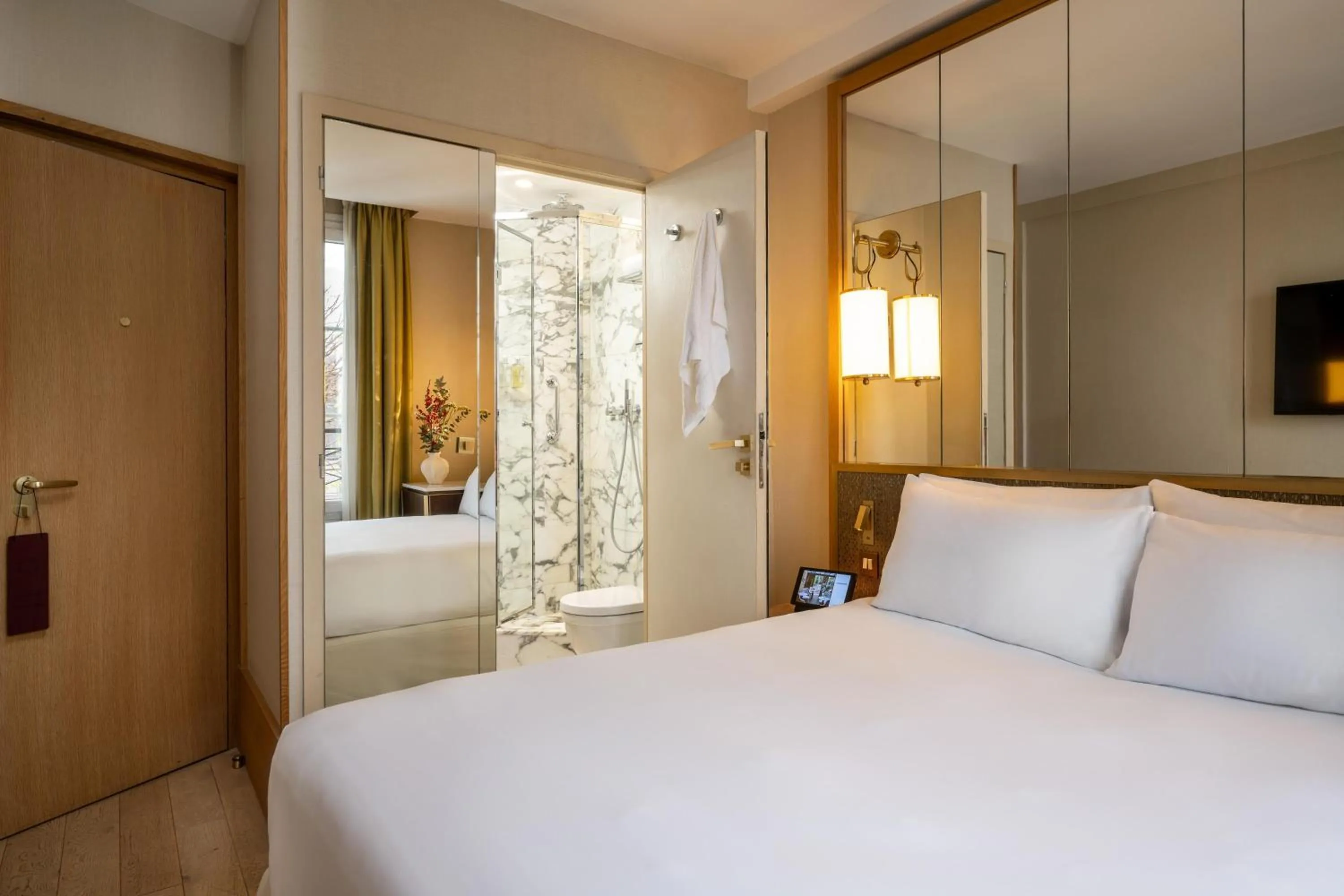 Bed in Le Belgrand Hotel Paris Champs Elysees, Tapestry By Hilton