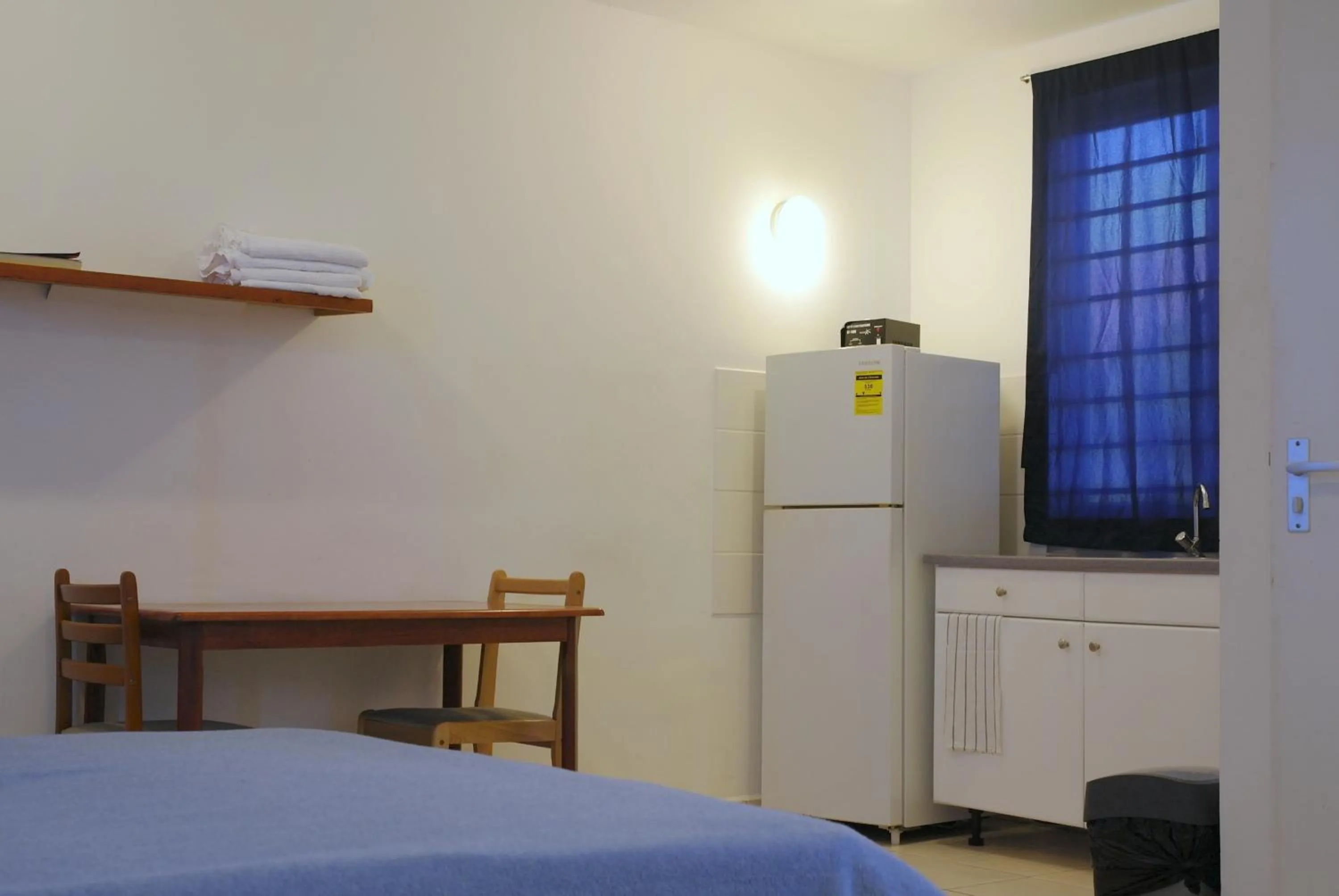 Seating area, Bed in Orange Rembrandt Studio Apartments