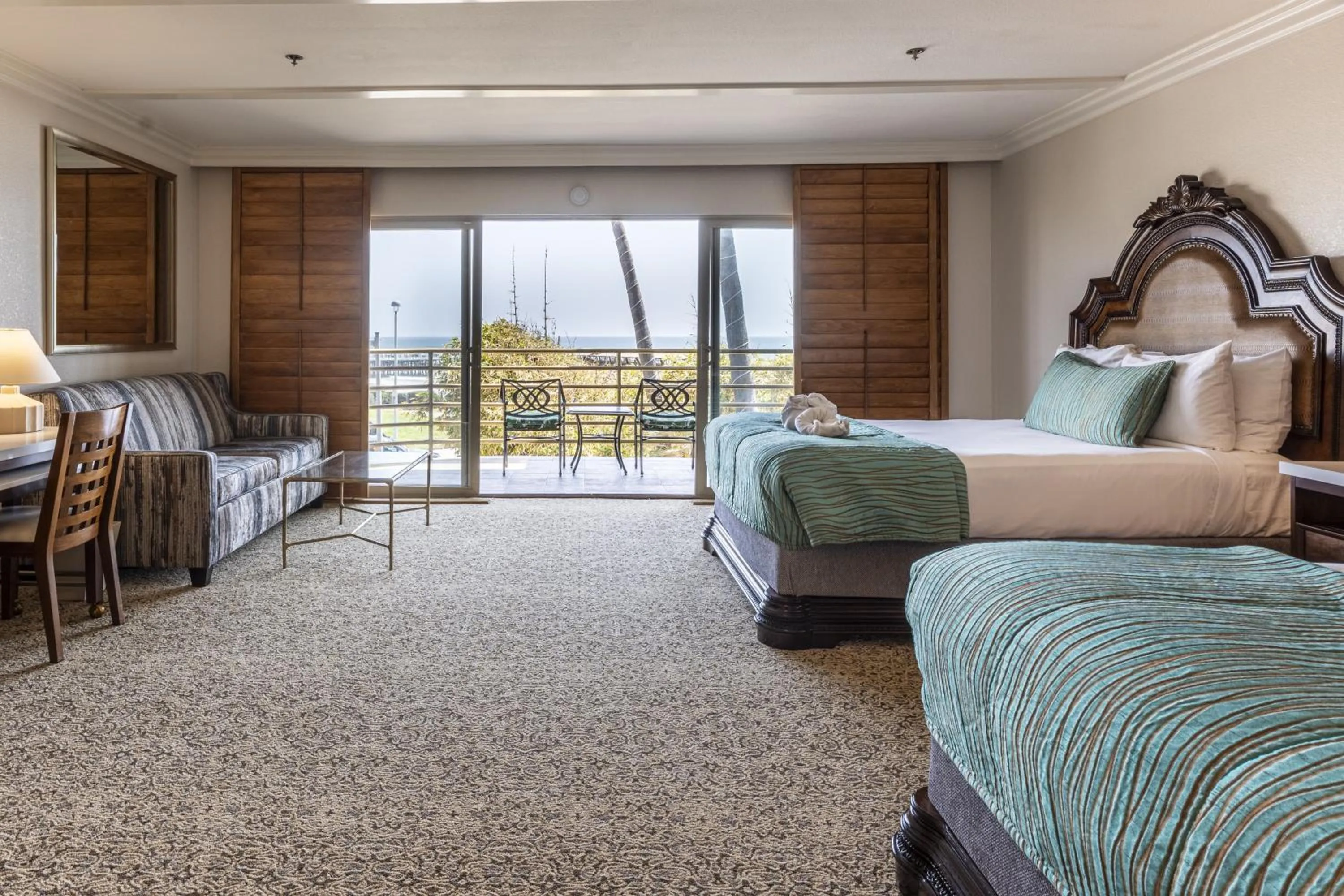 Bed in Pacific Terrace Hotel