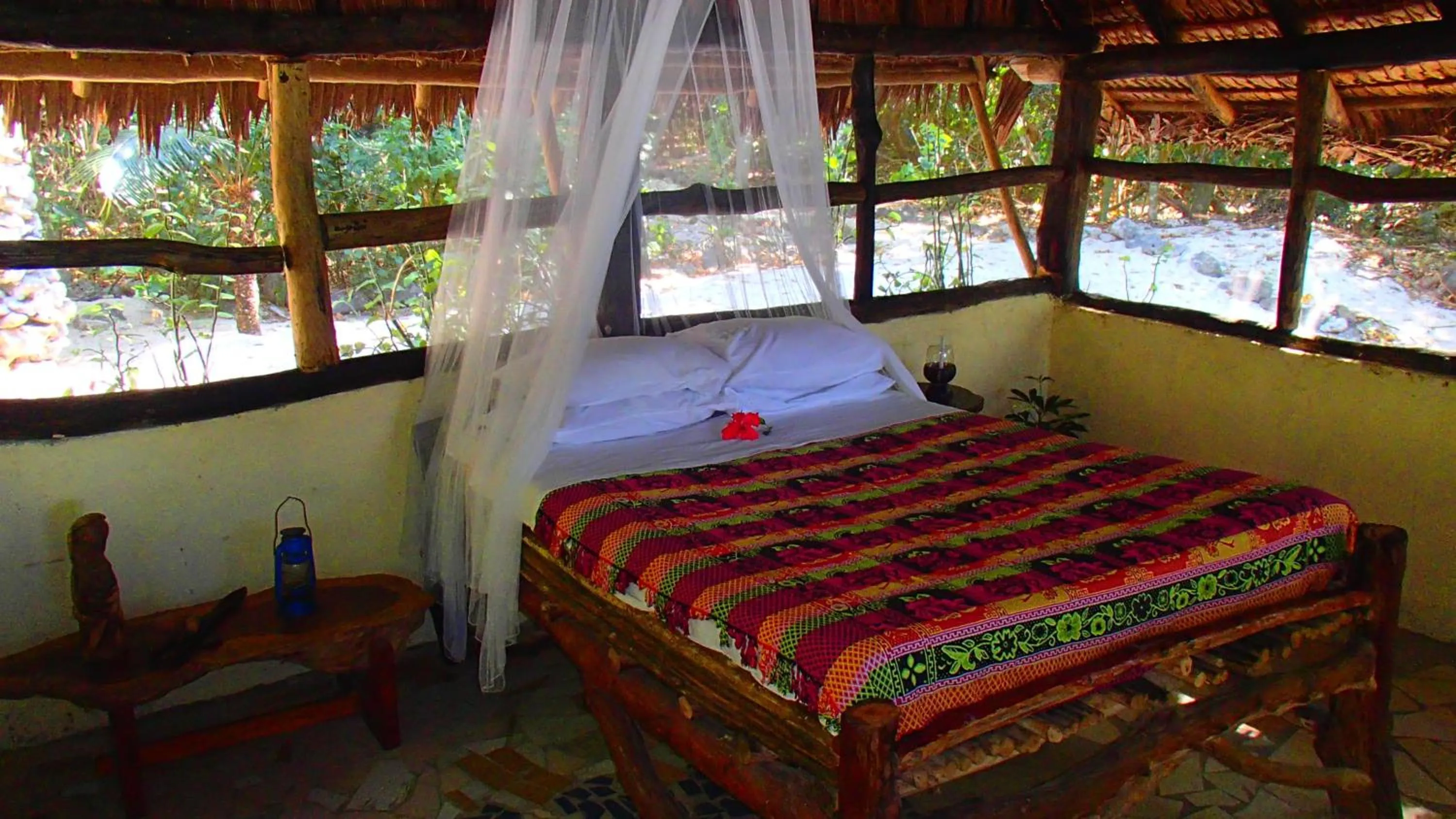 Bed in Tranquility Island Eco Dive Resort