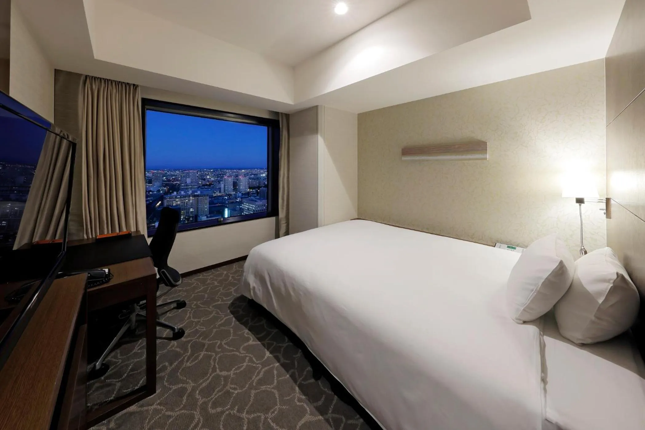 Photo of the whole room, Bed in JR Tower Hotel Nikko Sapporo