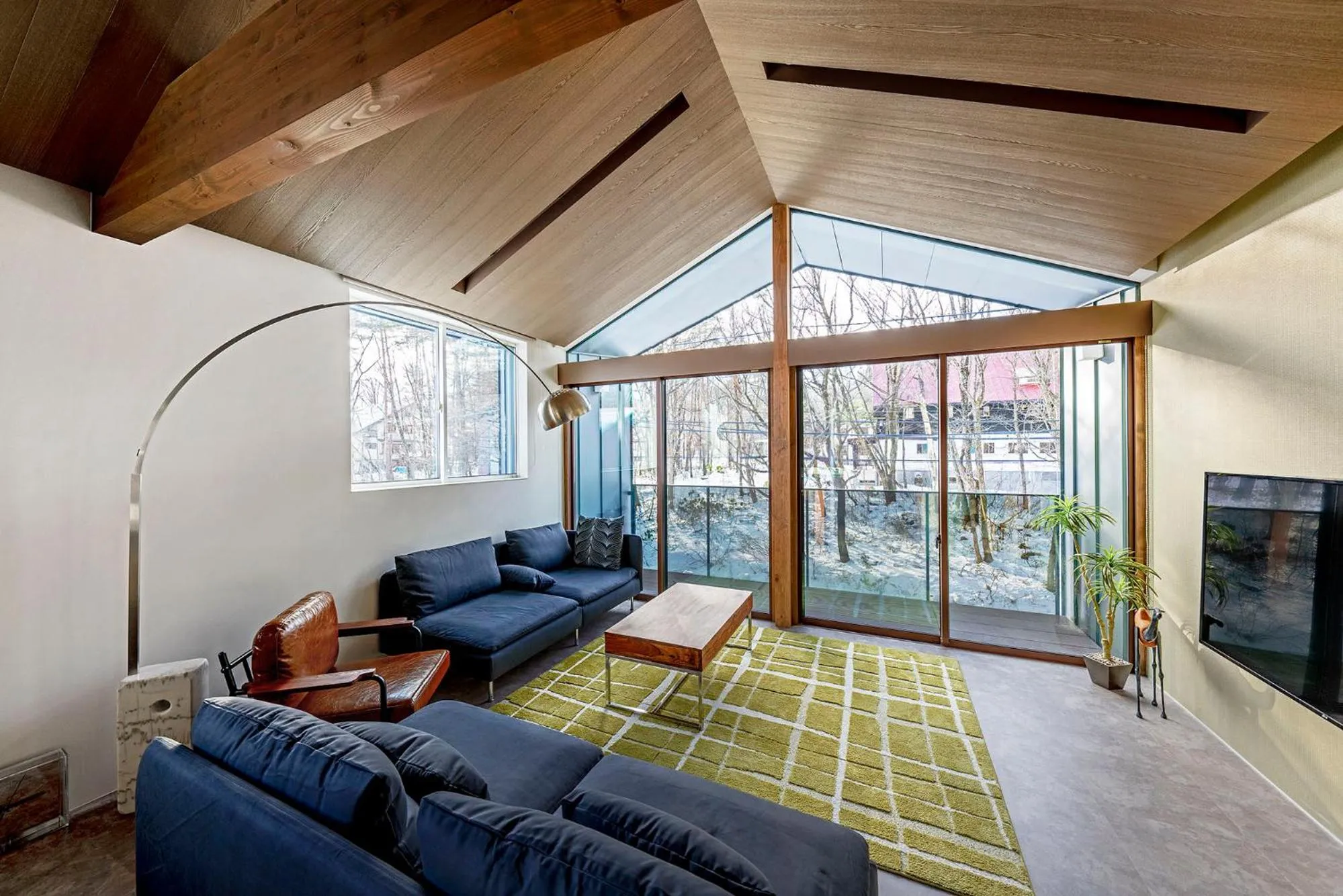 Living room in Grey Wolf Chalet by Hakuba White Fox Company