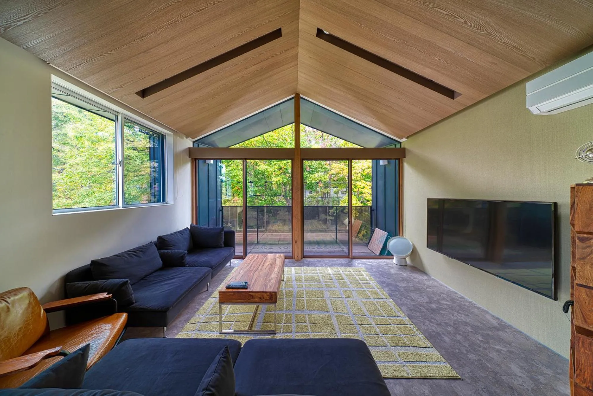 Living room in Grey Wolf Chalet by Hakuba White Fox Company