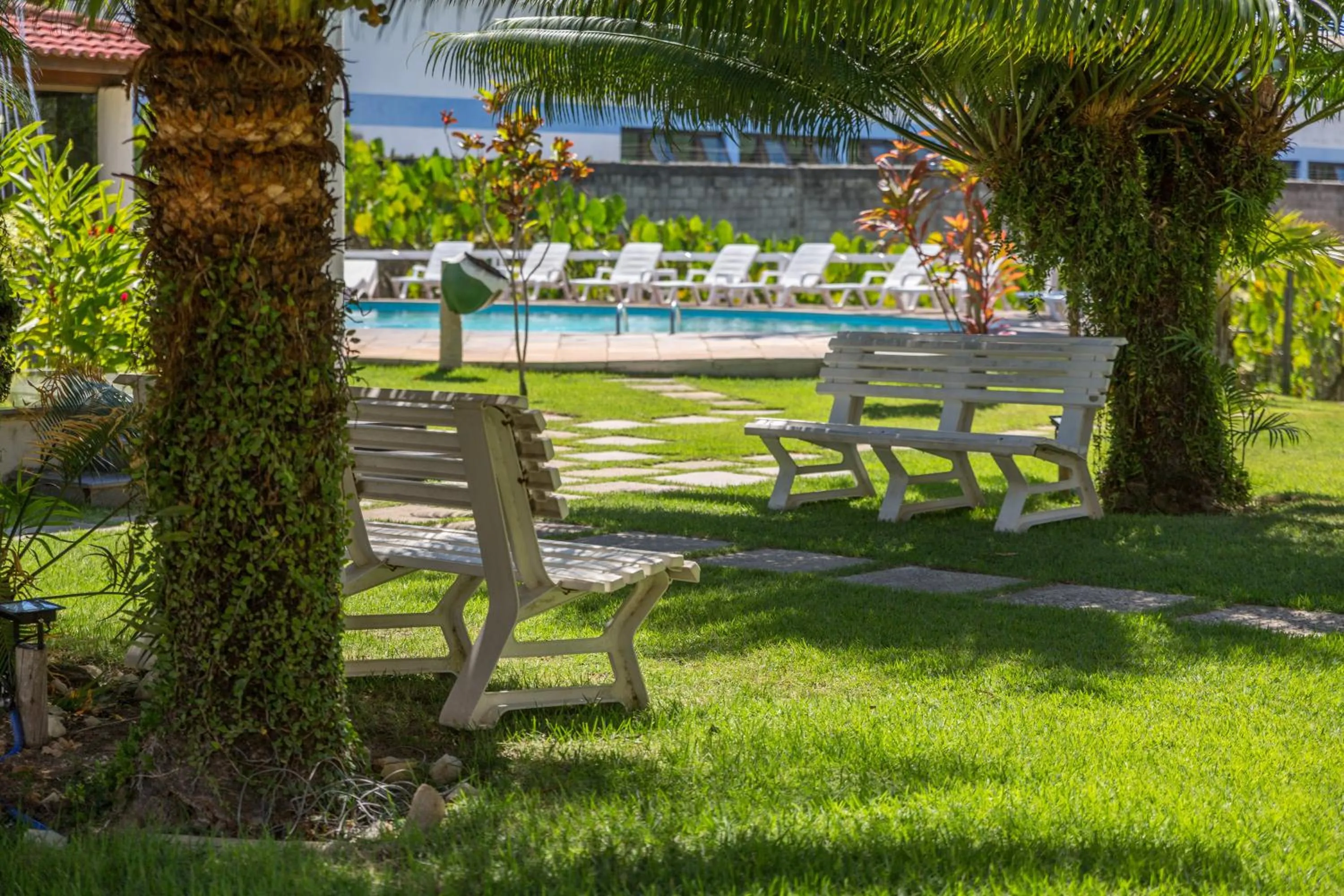 Garden view in America Praia Flat - Portal Hotéis