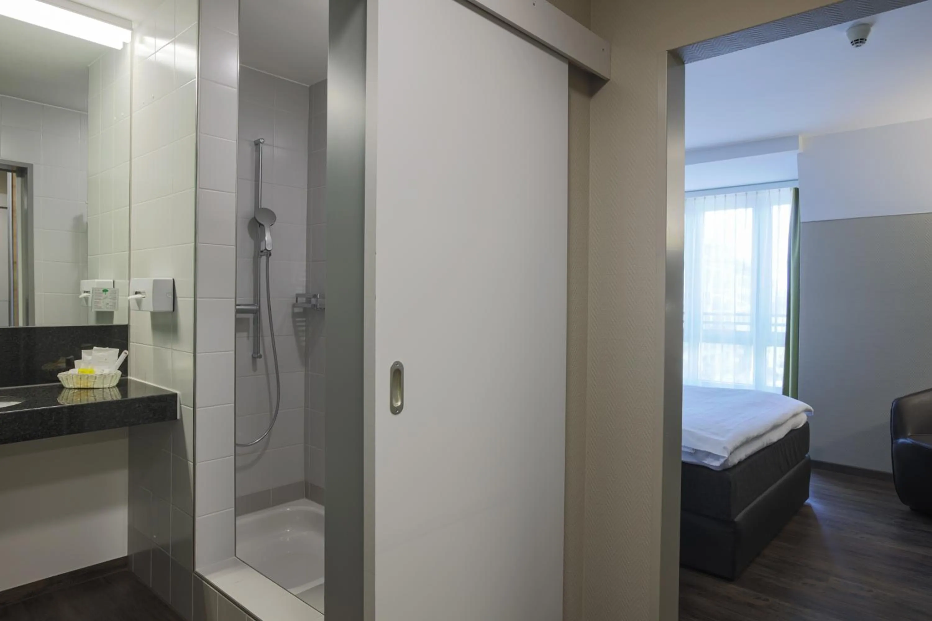 Bathroom, Bed in Herisau Swiss Quality Hotel