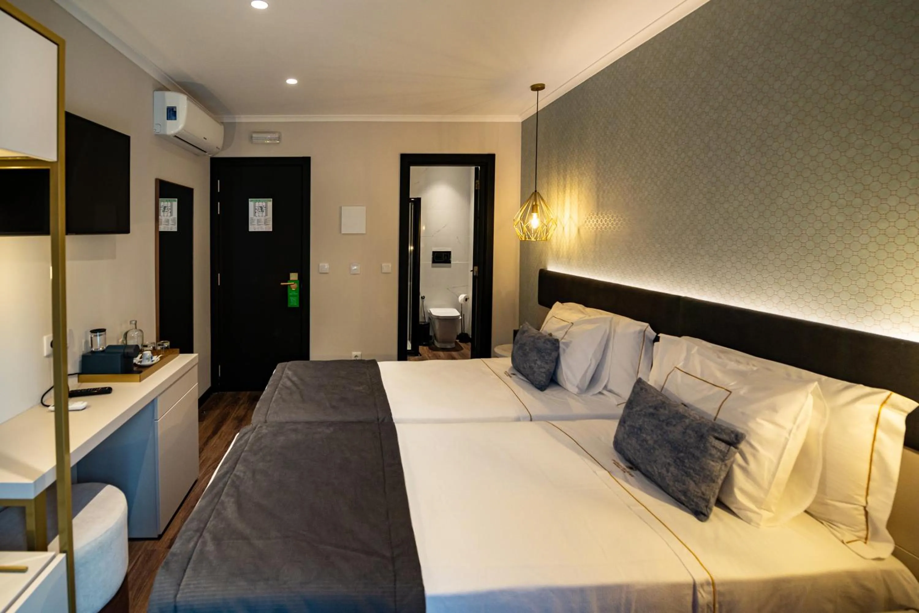 Bed in Duplo Charme Boutique Hotel