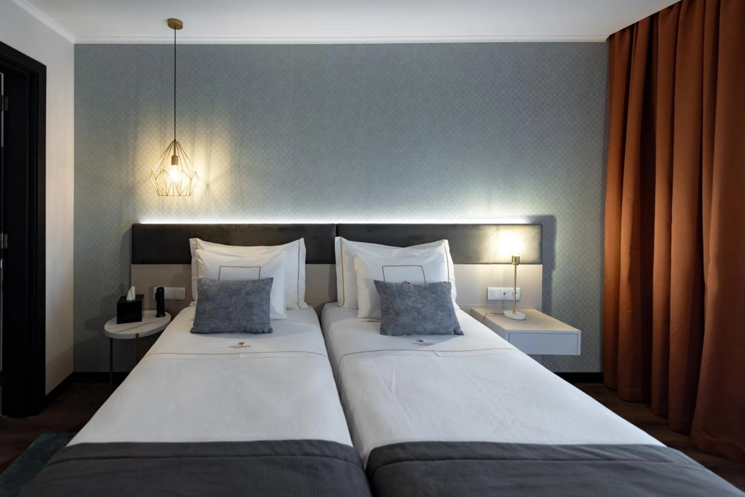 Bed in Duplo Charme Boutique Hotel