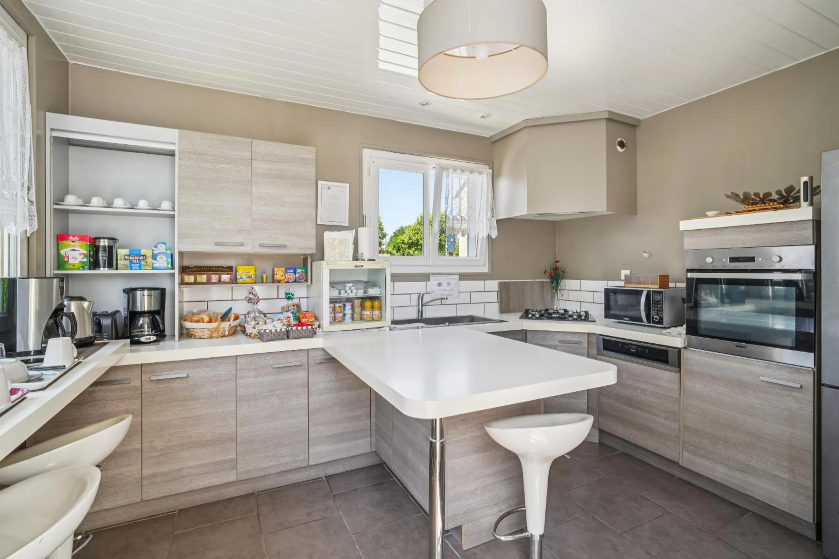 Kitchen or kitchenette in Roissy Chambres