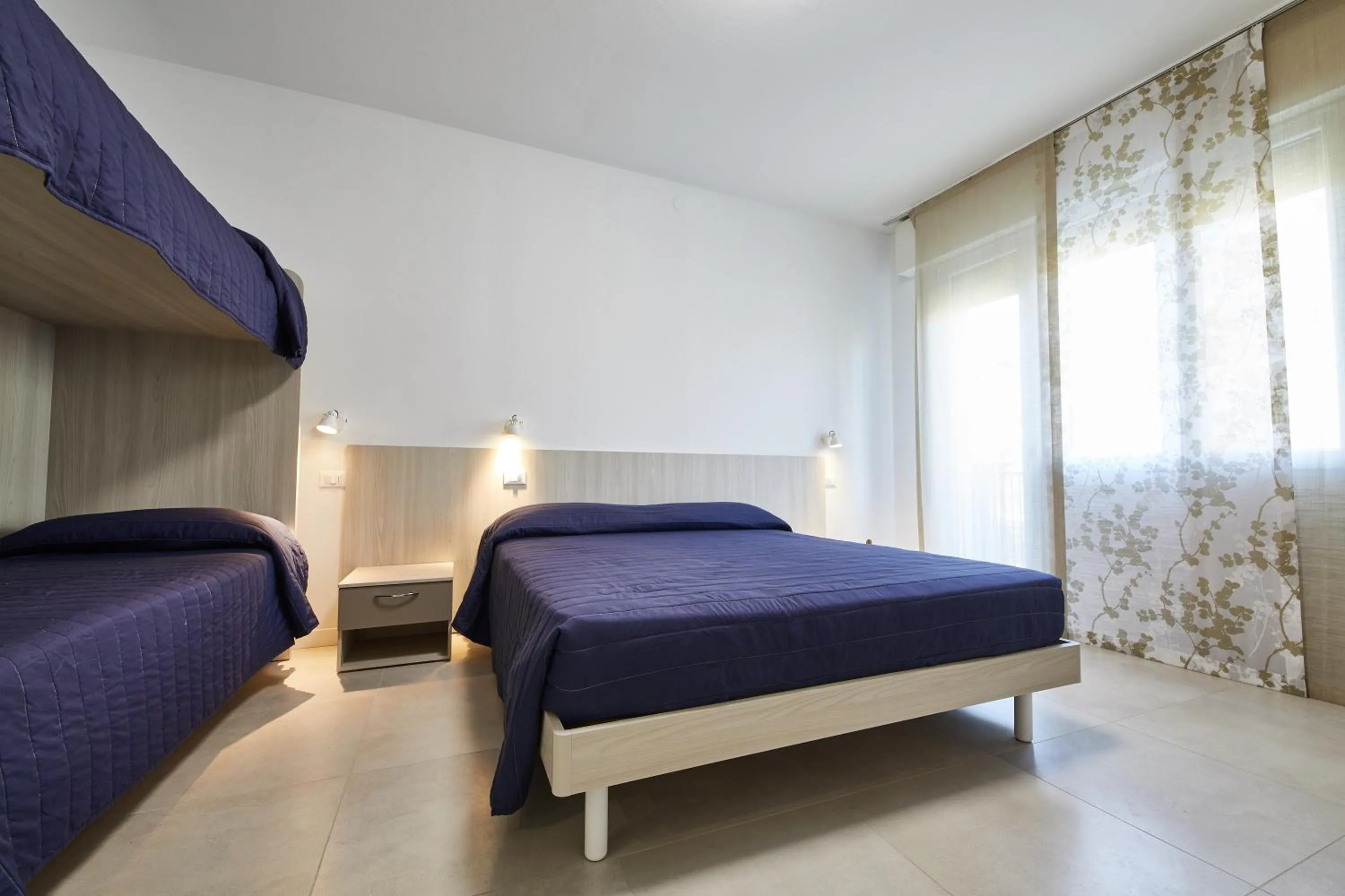 Bed in Lilium Maris Hotel