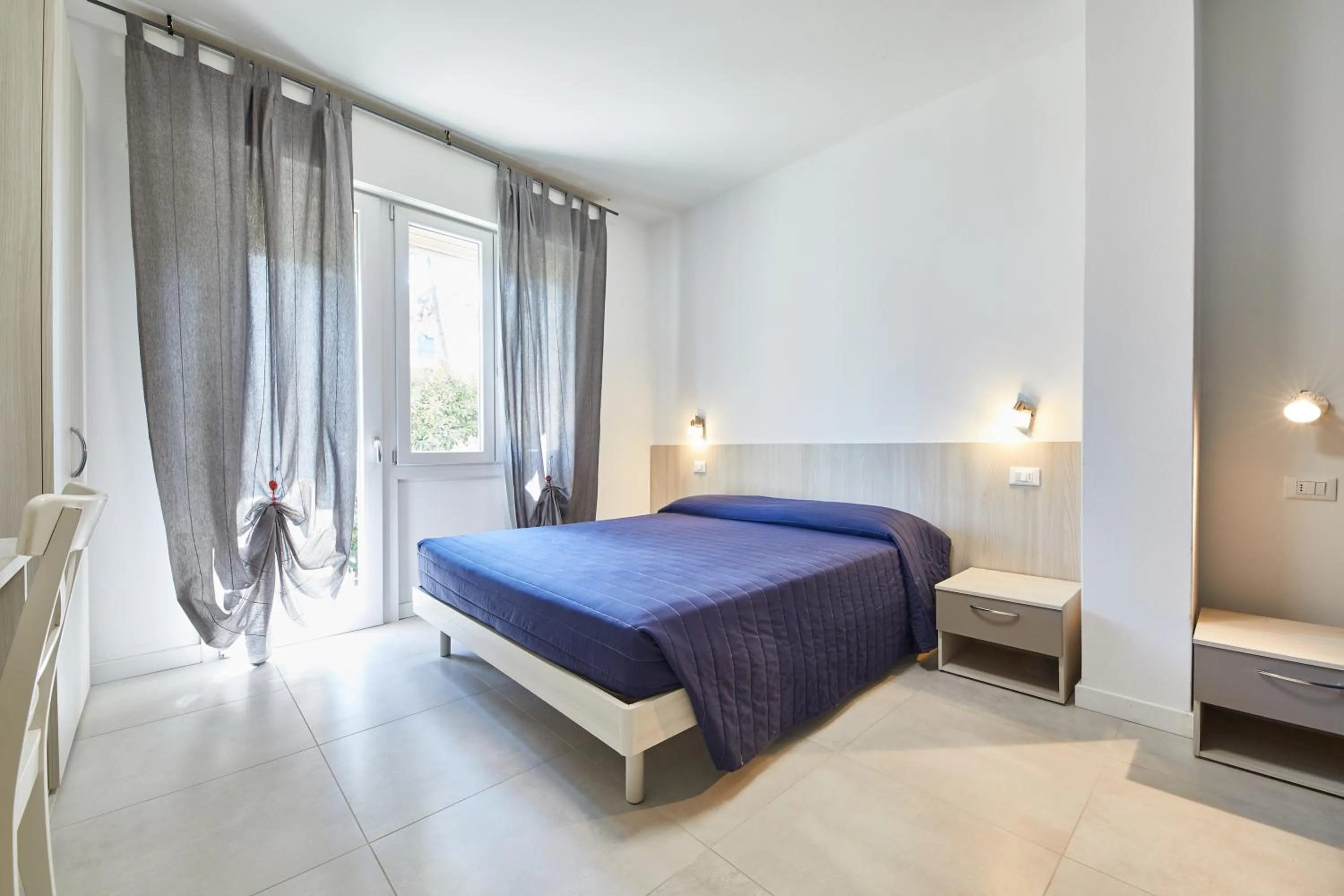 Bed in Lilium Maris Hotel