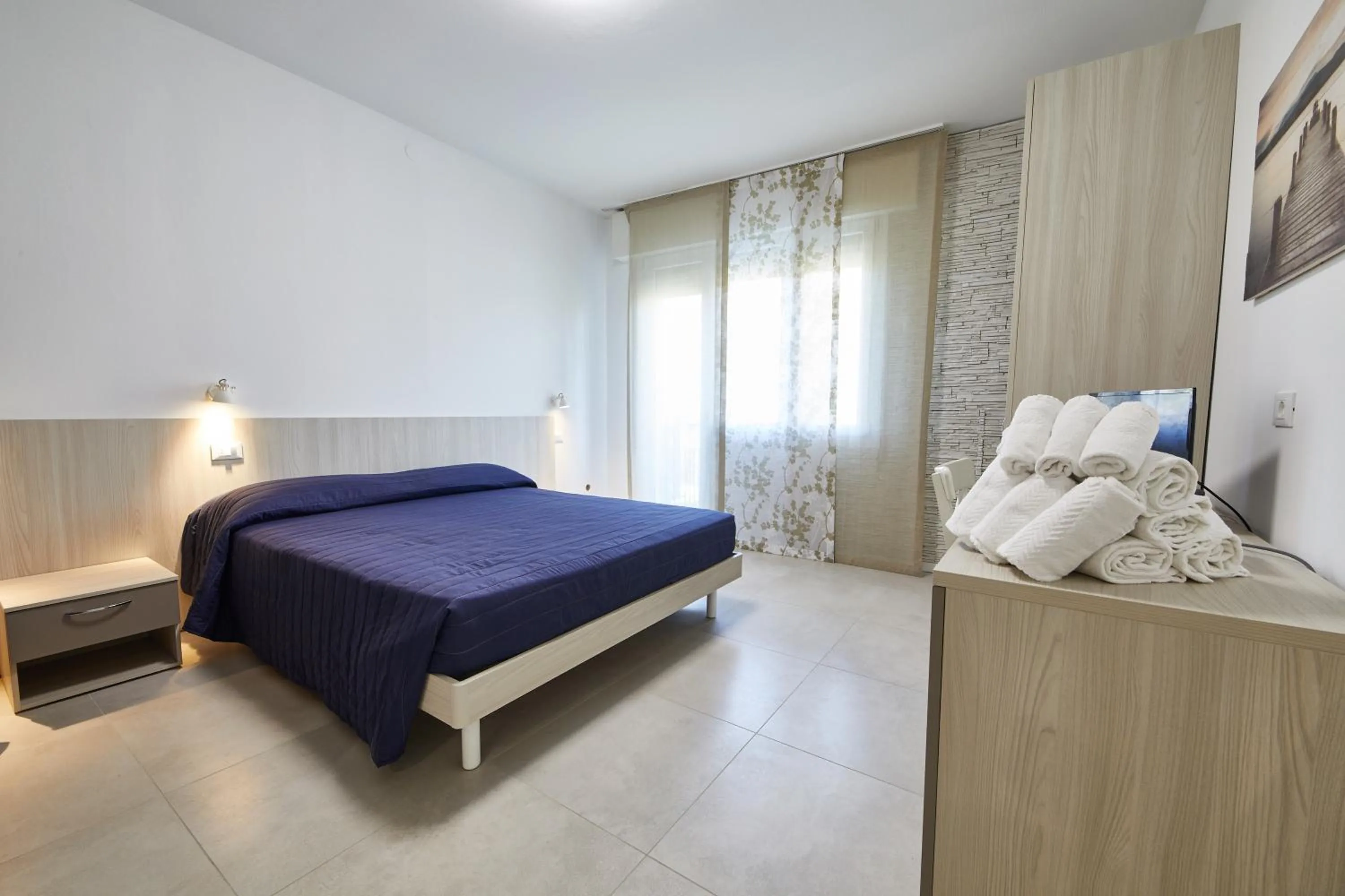 Bed in Lilium Maris Hotel