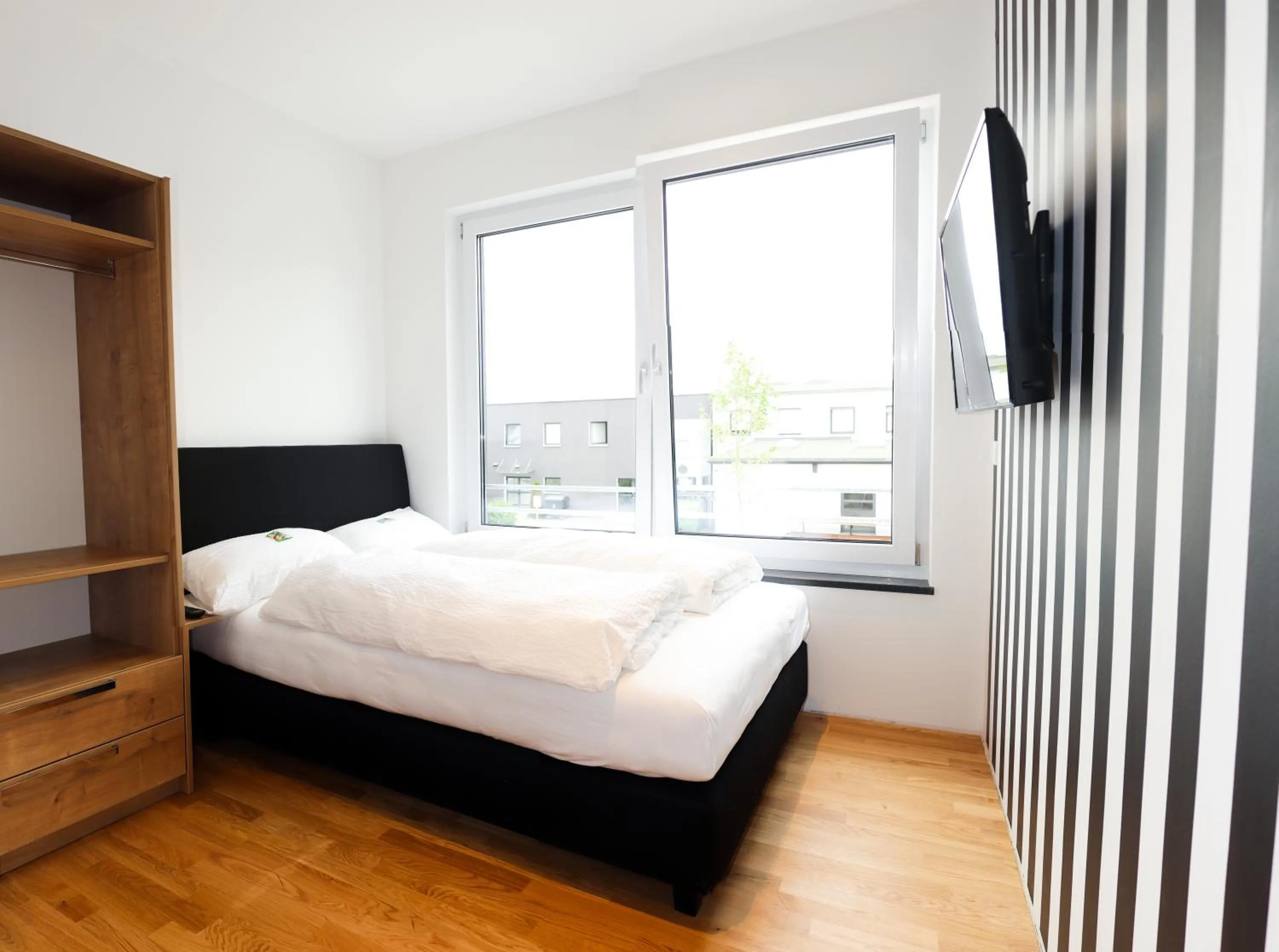 Bed in Das Fischer Boardinghouse BW