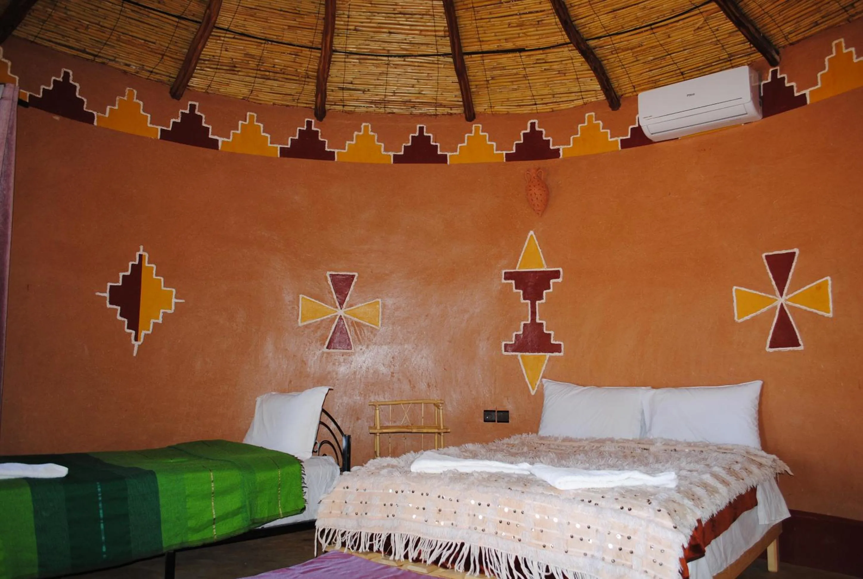 Bed in Ecolodge La Palmeraie