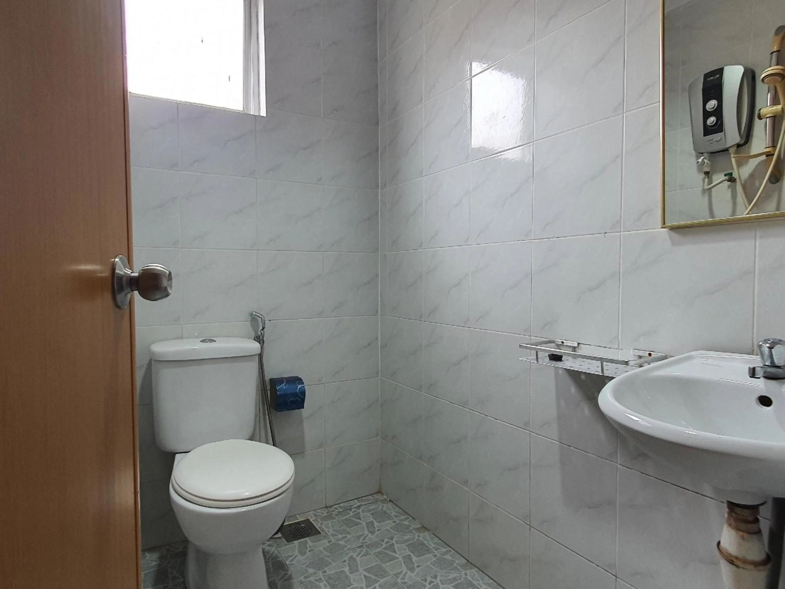 Bathroom in Hotel O Melody 88 Inn