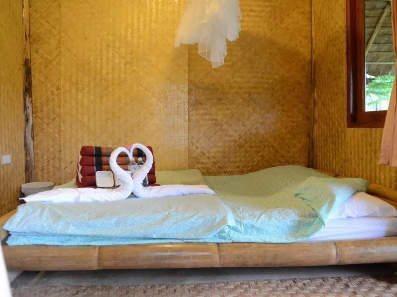 Bed in Baan Pai Riverside Resort