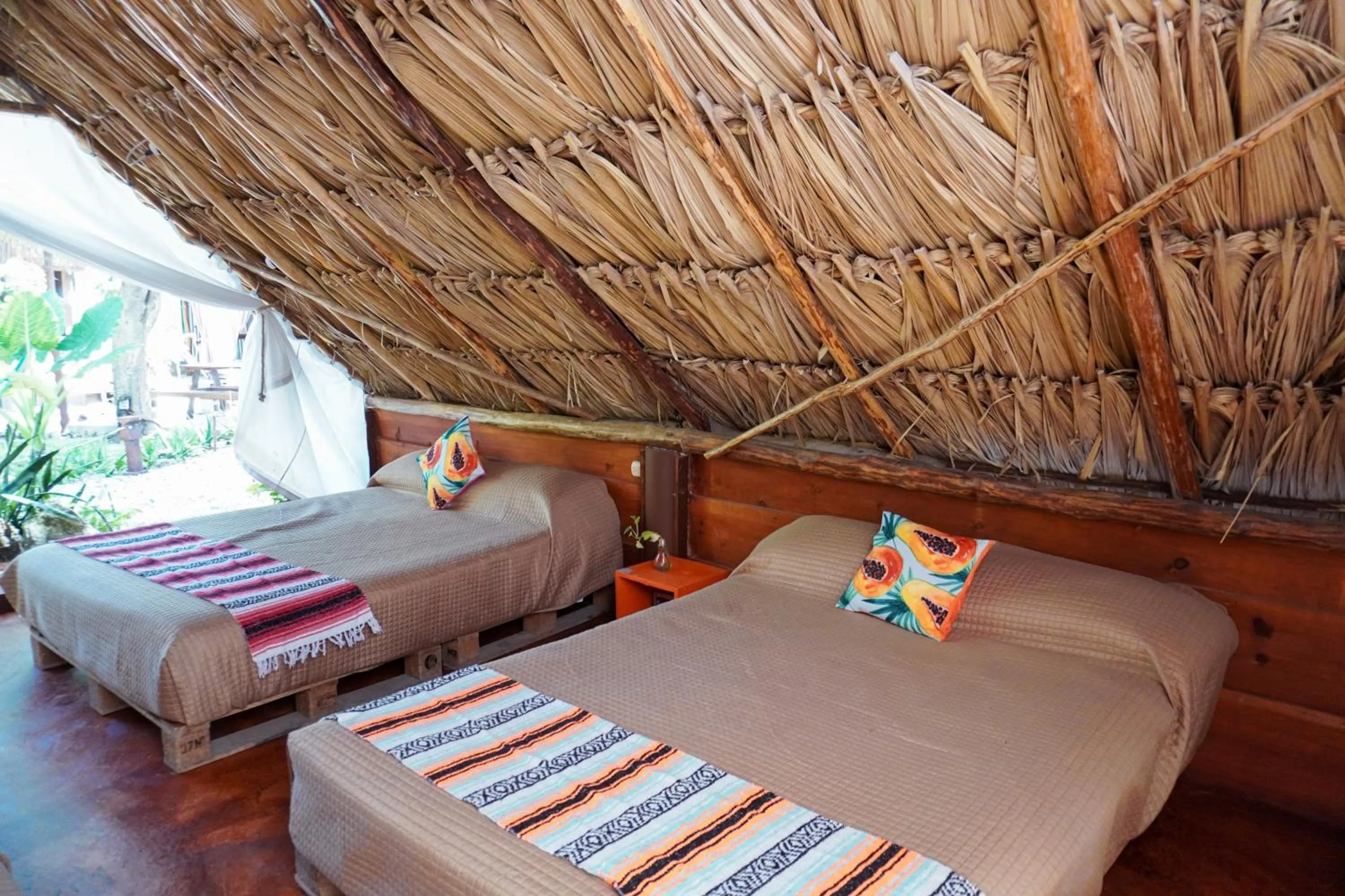 Photo of the whole room, Bed in El Búho Bacalar Eco-Cabañas Hostal