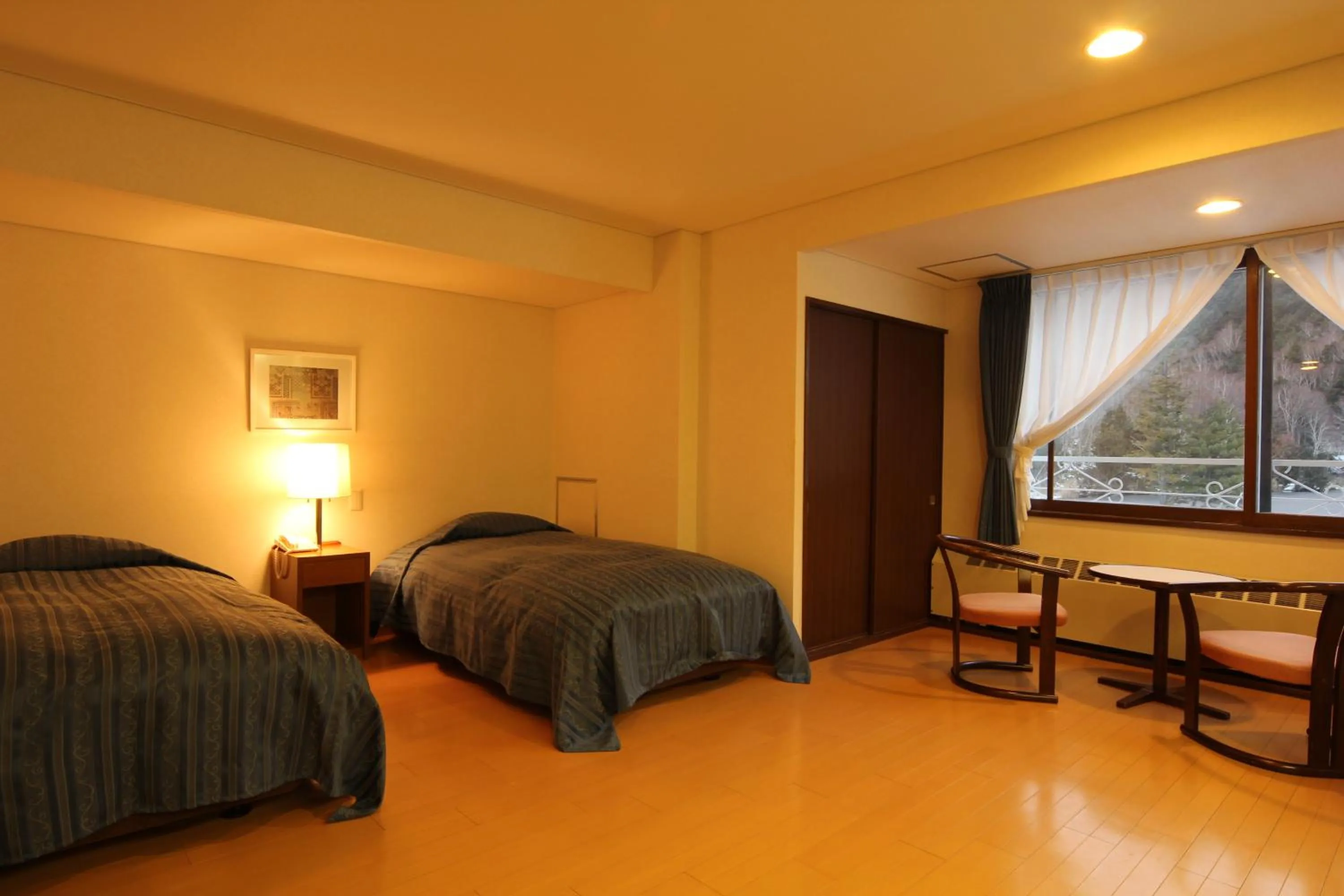 Bed in Kidoike Onsen Hotel