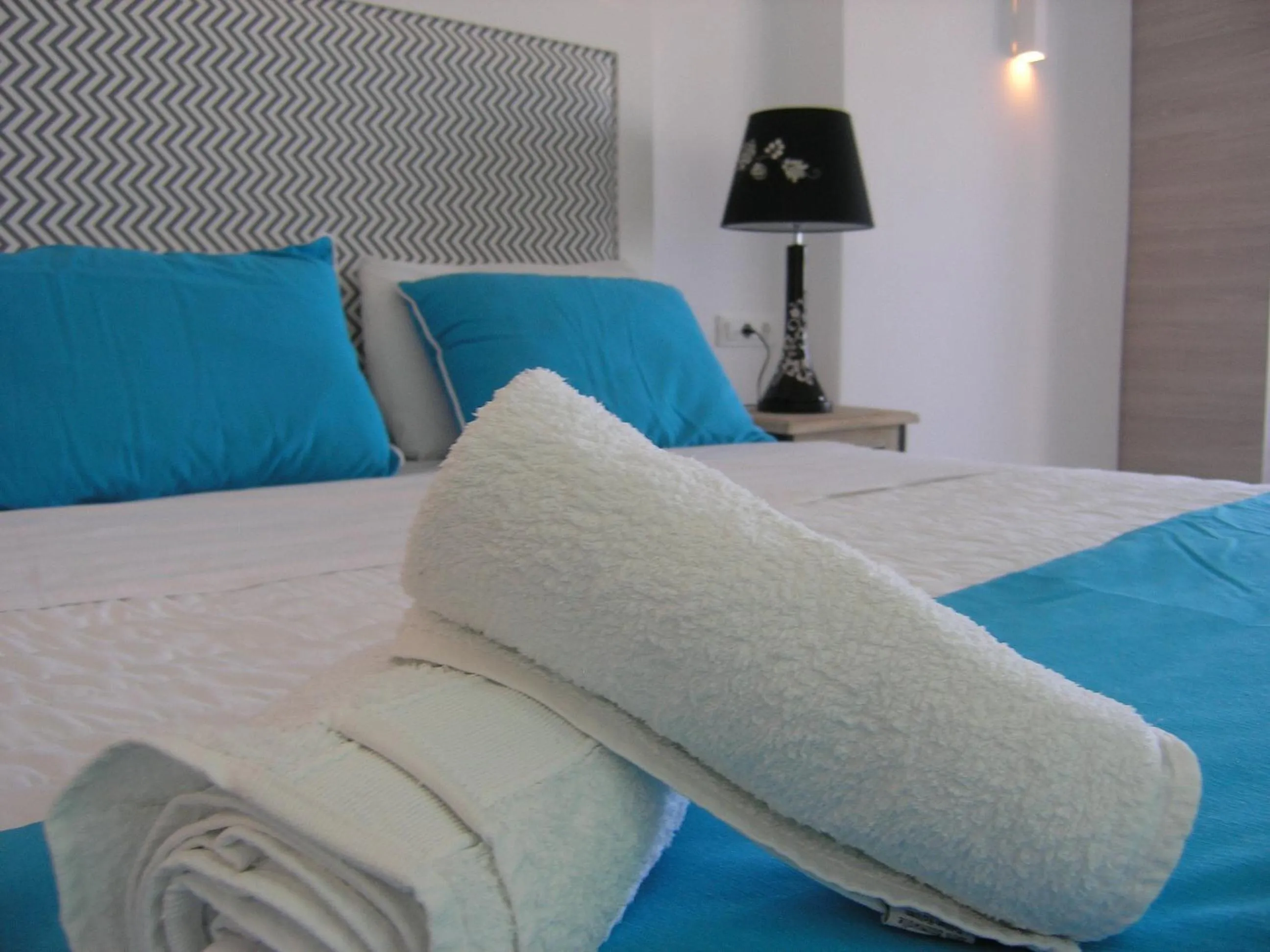 Bed in Blue Waves Suites & Apartments