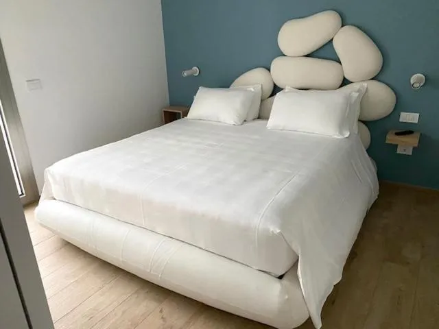 Bed in YOUMAMI Suite Hotel Wellness&Spa