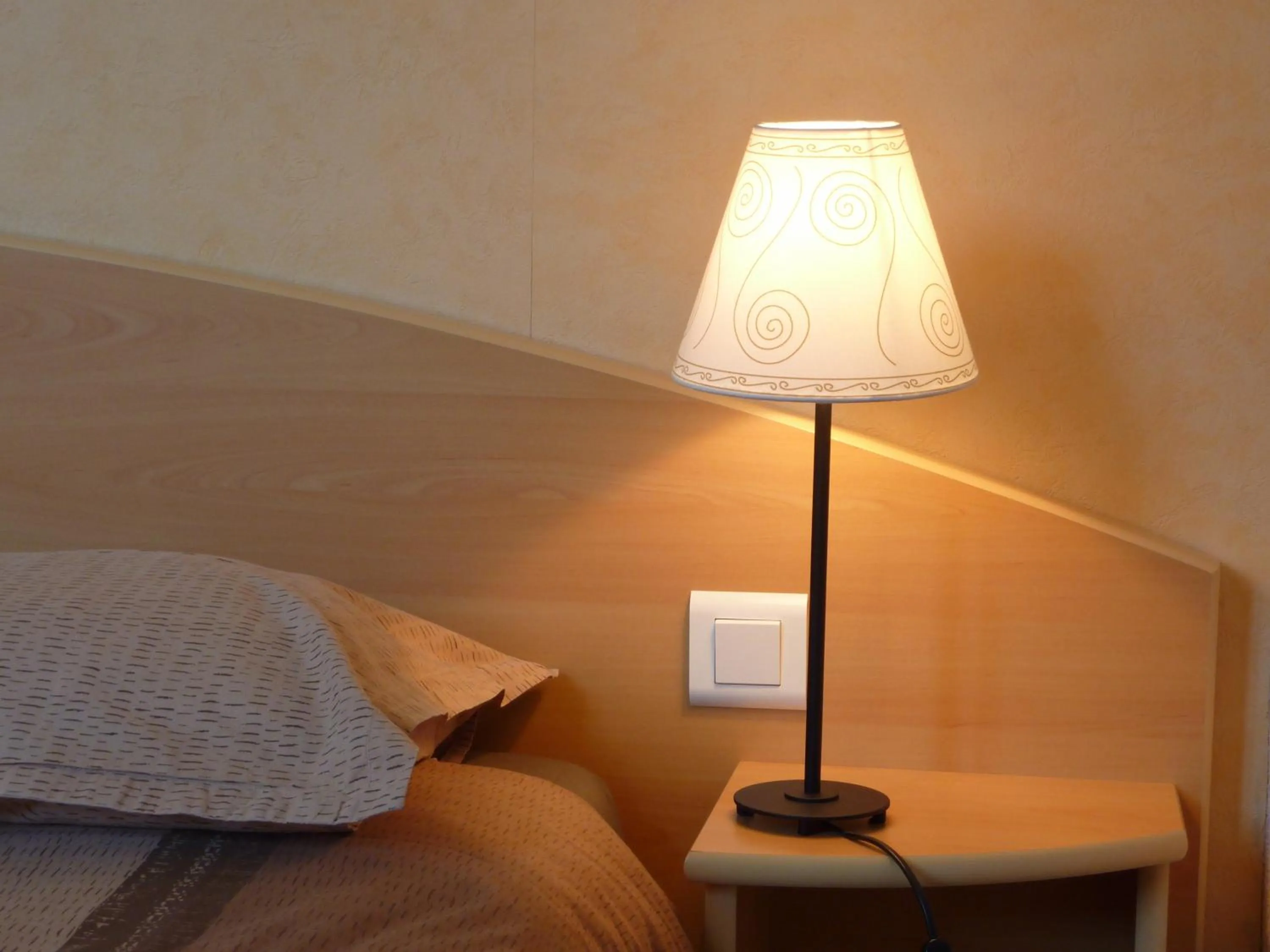 Bed in Cit'Hotel de La Vallée