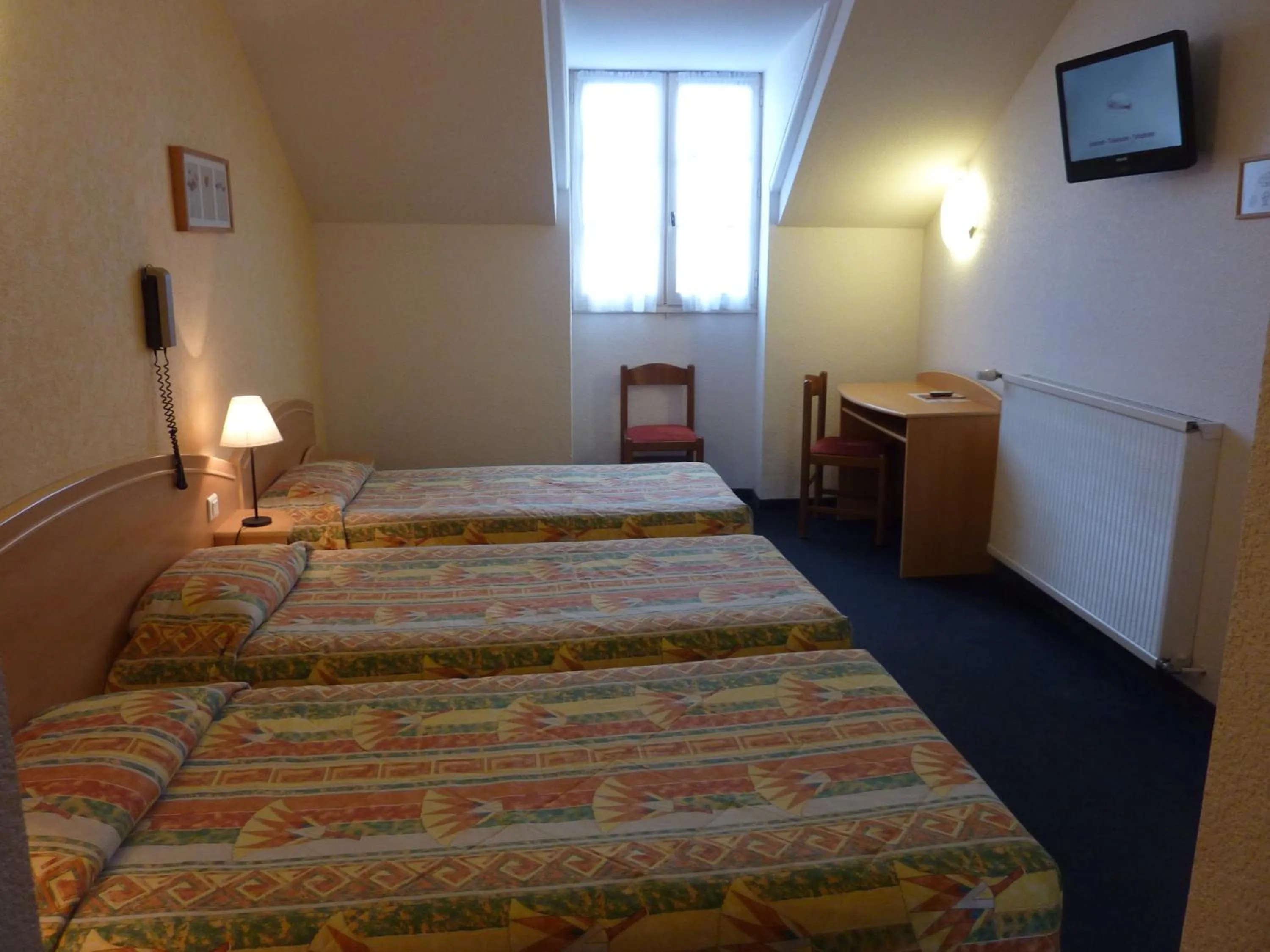 Bed in Cit'Hotel de La Vallée