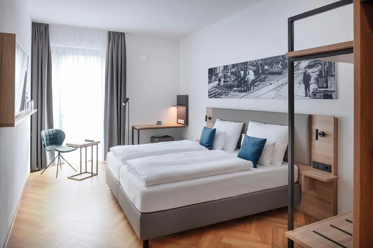 Living room, Bed in ECOME Hotel