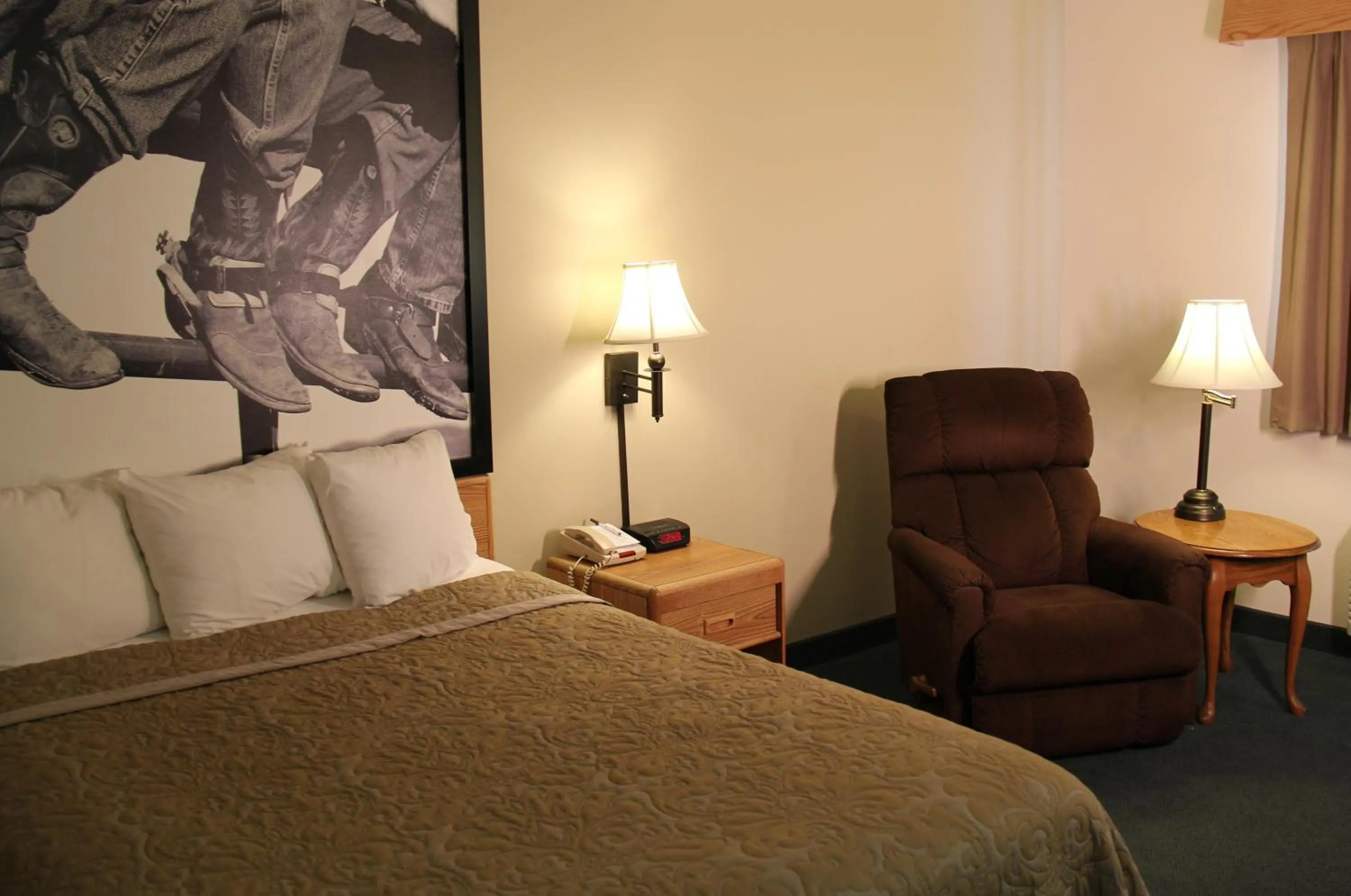 Bed in Homestead Inn and Suites