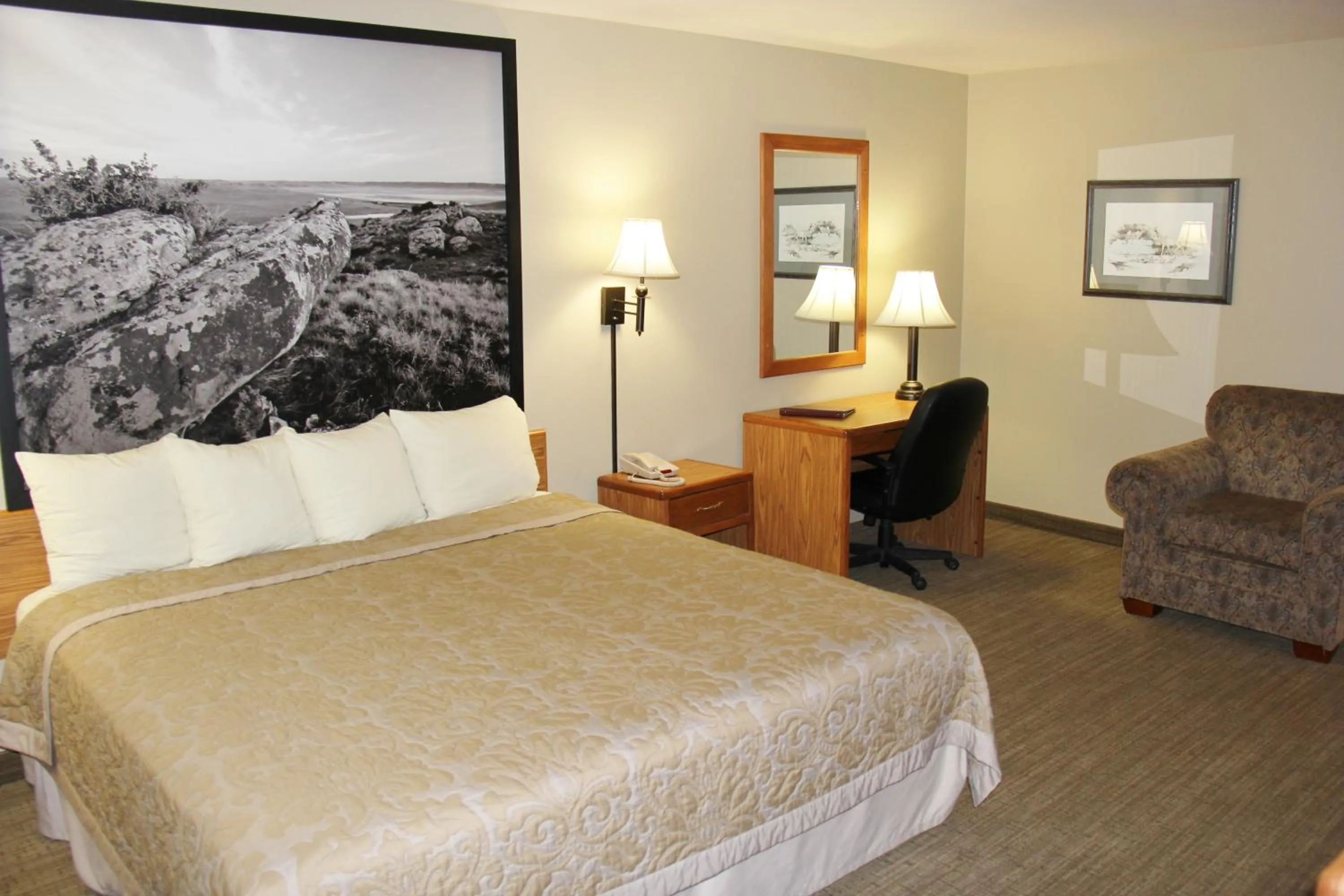 Bed in Homestead Inn and Suites