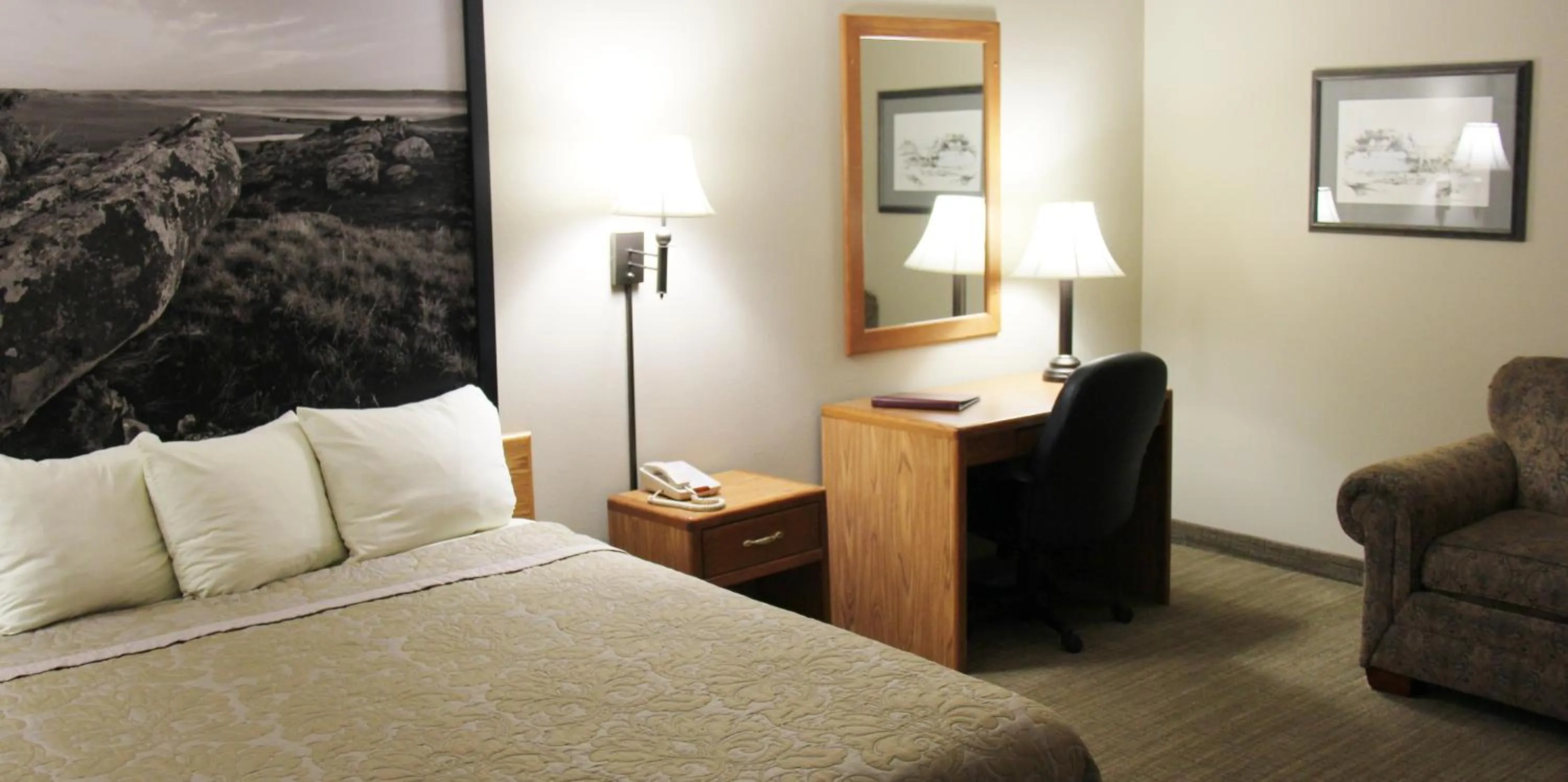 Bed in Homestead Inn and Suites